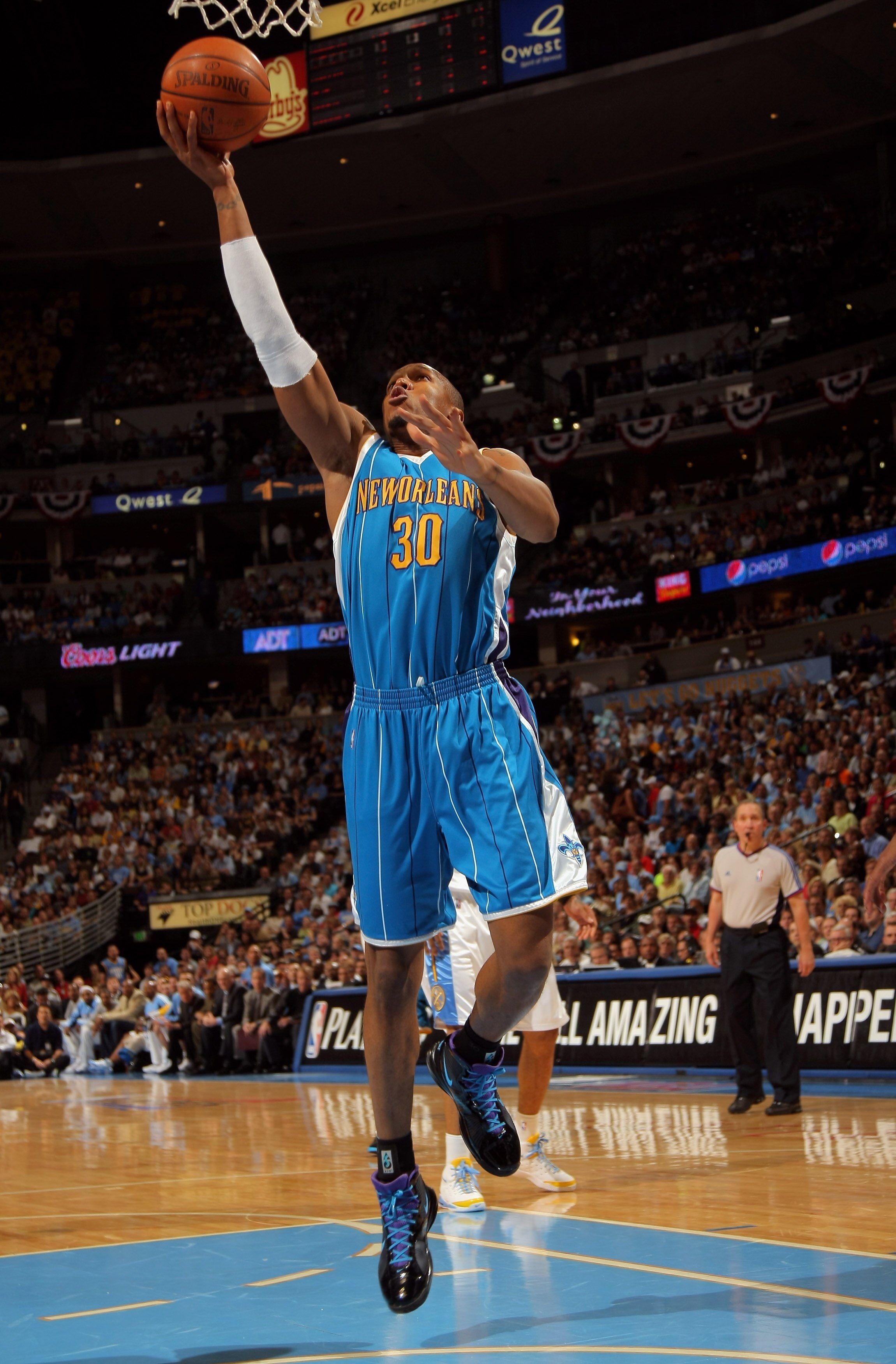 DENVER - APRIL 22:  David West #30 of the New Orleans Hornets lays up a shot against the Denver Nuggets in Game Two of the Western Conference Quarterfinals during the 2009 NBA Playoffs at Pepsi Center on April 22, 2009 in Denver, Colorado. NOTE TO USER: U