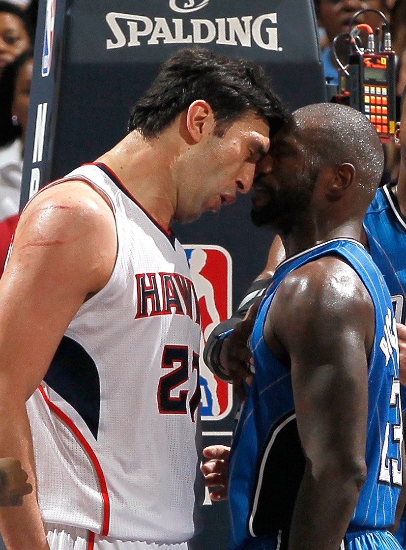 ATLANTA, GA - APRIL 22:  Zaza Pachulia #27 of the Atlanta Hawks headbutts Jason Richardson #23 of the Orlando Magic during Game Three of the Eastern Conference Quarterfinals in the 2011 NBA Playoffs at Philips Arena on April 22, 2011 in Atlanta, Georgia.