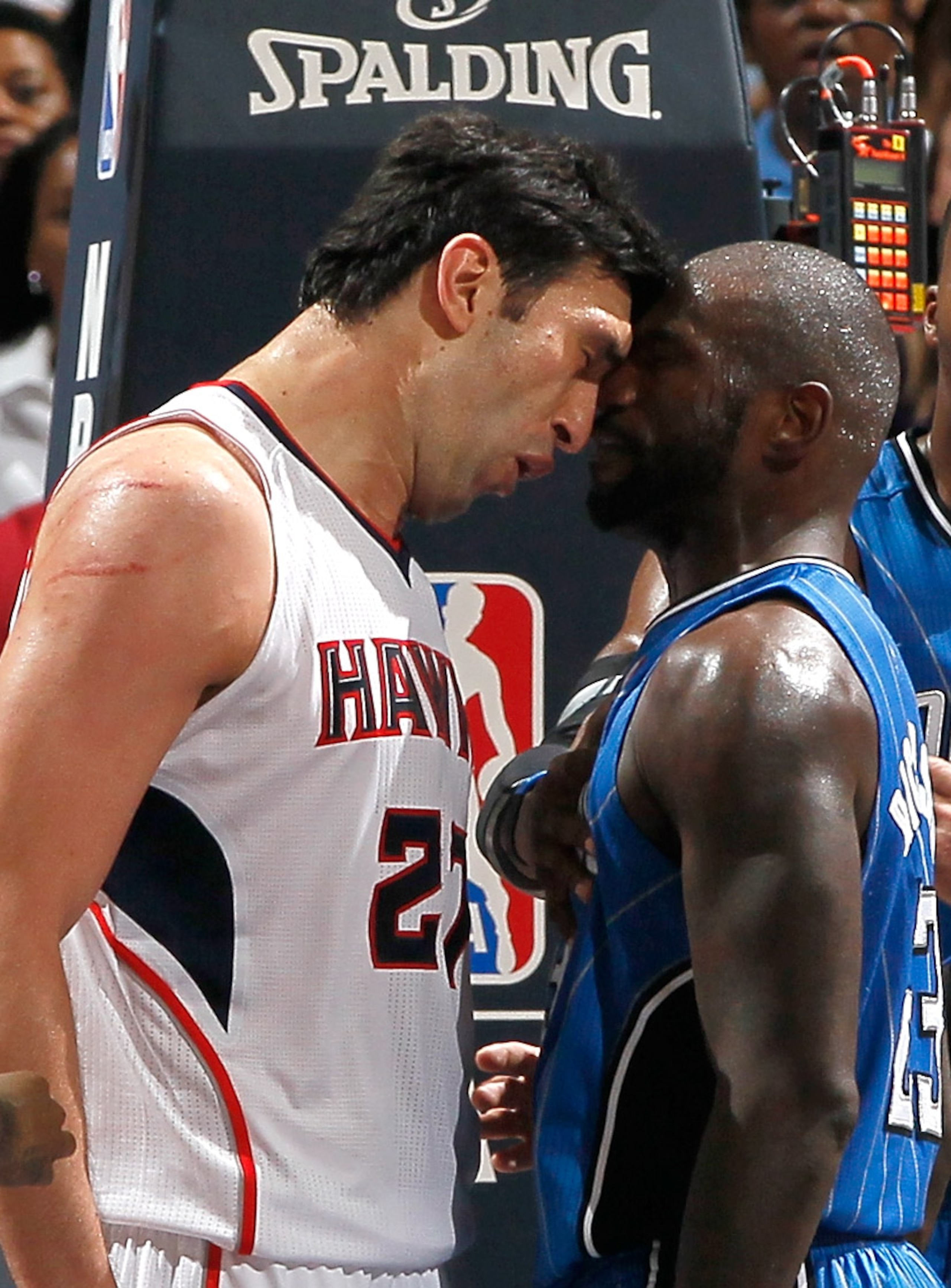 ATLANTA, GA - APRIL 22:  Zaza Pachulia #27 of the Atlanta Hawks headbutts Jason Richardson #23 of the Orlando Magic during Game Three of the Eastern Conference Quarterfinals in the 2011 NBA Playoffs at Philips Arena on April 22, 2011 in Atlanta, Georgia.