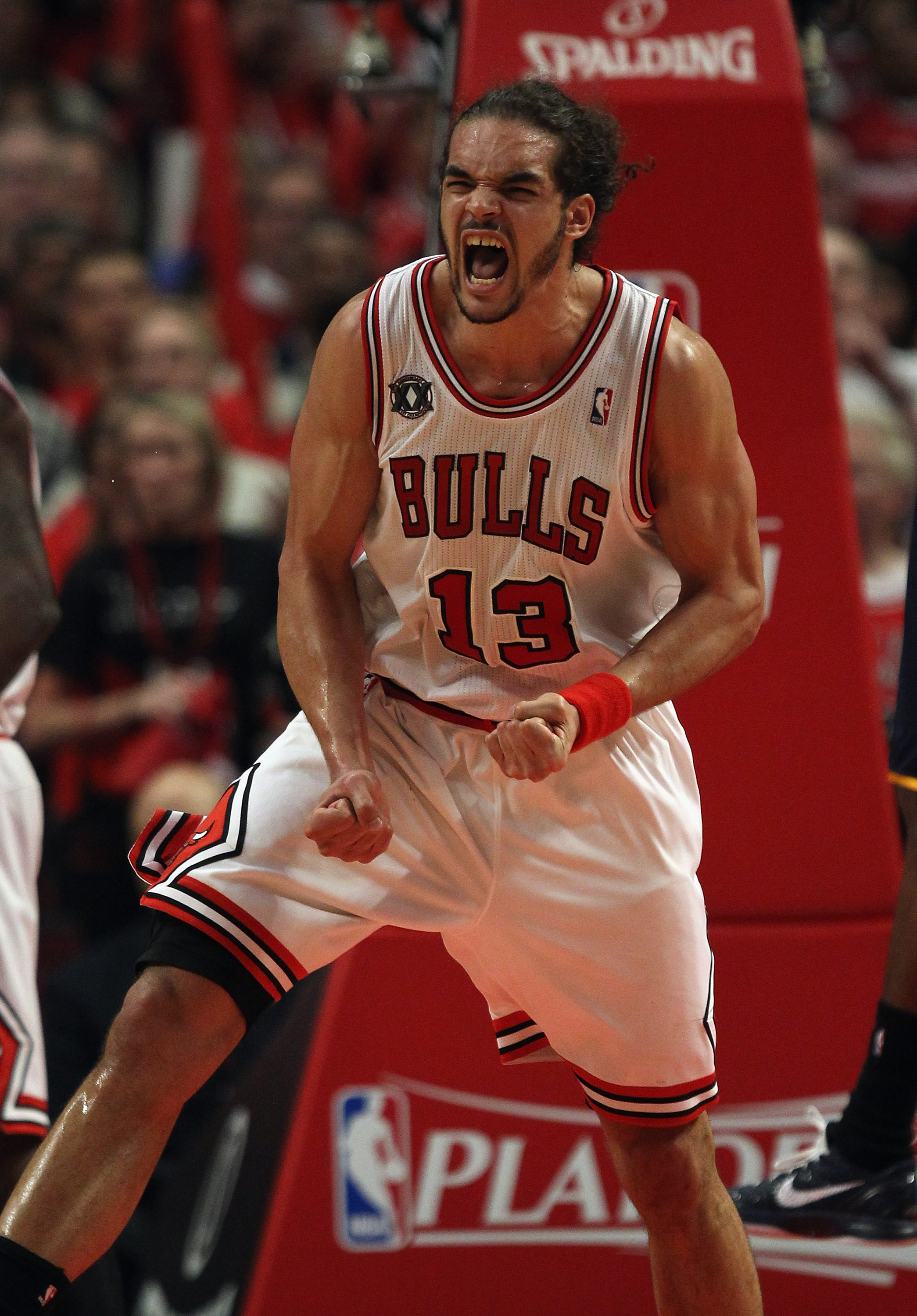 CHICAGO, IL - APRIL 18: Joakim Noah #13 of the Chicago Bulls celebrates a play against the Indiana Pacers in Game Two of the Eastern Conference Quarterfinals in the 2011 NBA Playoffs at the United Center on April 18, 2011 in Chicago, Illinois. The Bulls d