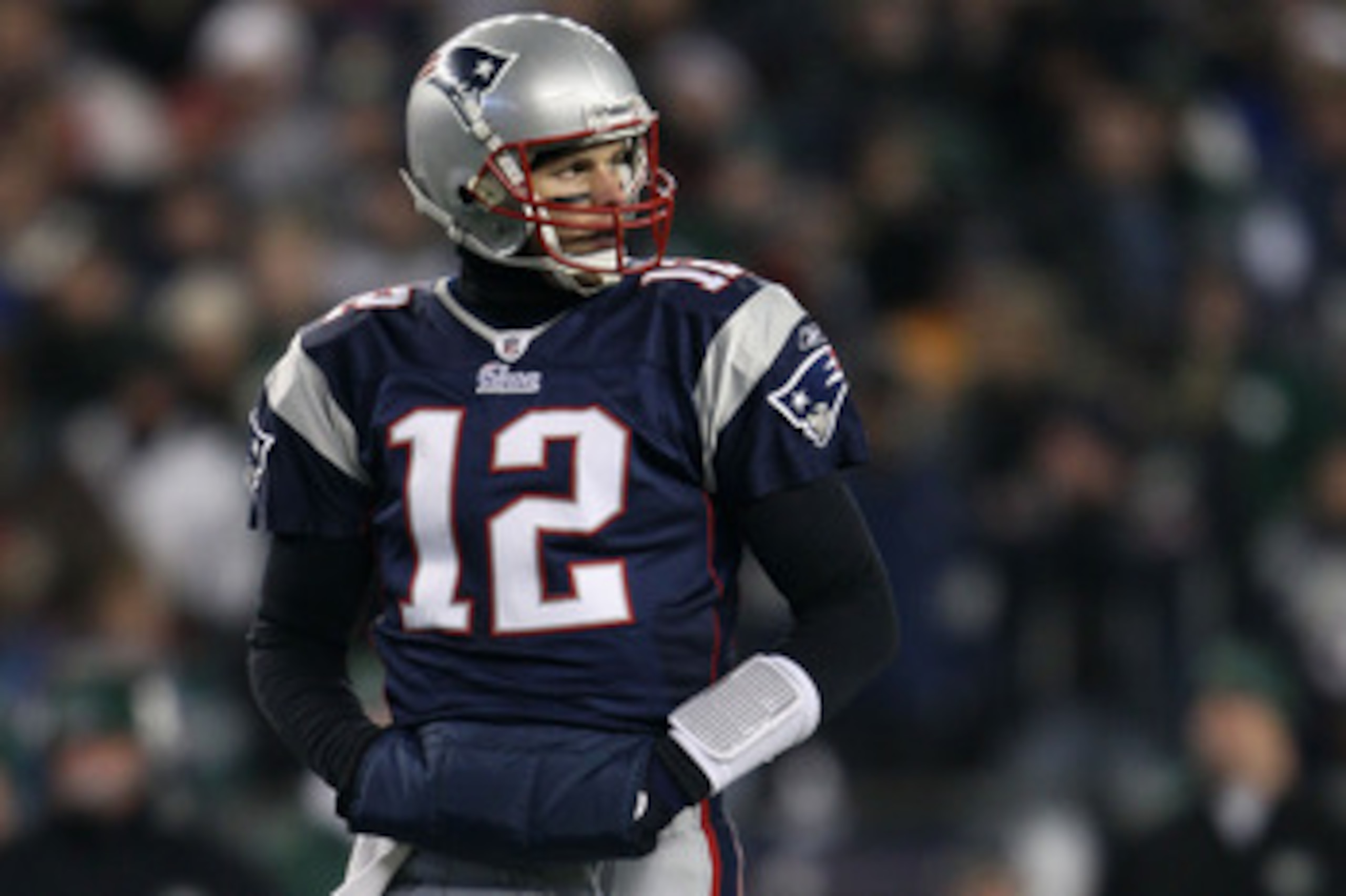 FOXBORO, MA - JANUARY 16:  Quarterback Tom Brady #12 of the New England Patriots stands on the field during their 2011 AFC divisional playoff game against the New York Jets at Gillette Stadium on January 16, 2011 in Foxboro, Massachusetts.  (Photo by Elsa