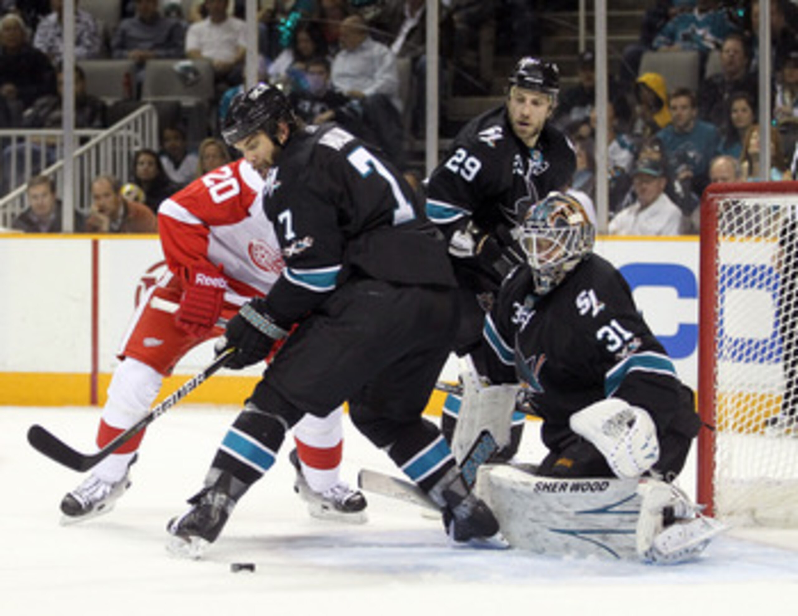 SAN JOSE, CA - APRIL 29: Niclas Wallin #7 and Antti Niemi #31 of the San Jose Sharks stop the puck during their game against the Detroit Red Wings in Game One of the Western Conference Semifinals during the 2011 NHL Stanley Cup Playoffs at HP Pavilion on SAN JOSE, CA - APRIL 29: Niclas Wallin #7 and Antti Niemi #31 of the San Jose Sharks stop the puck during their game against the Detroit Red Wings in Game One of the Western Conference Semifinals during the 2011 NHL Stanley Cup Playoffs at HP Pavilion on