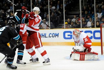 SAN JOSE, CA - MARCH 3: Joey MacDonald #31 of the Detroit Red Wings gets some help defending his goal from teammate Niklas Kronwall #55 against the San Jose Sharks in the second period of an NHL hockey game at the HP Pavilion on March 3, 2011 in San Jose,