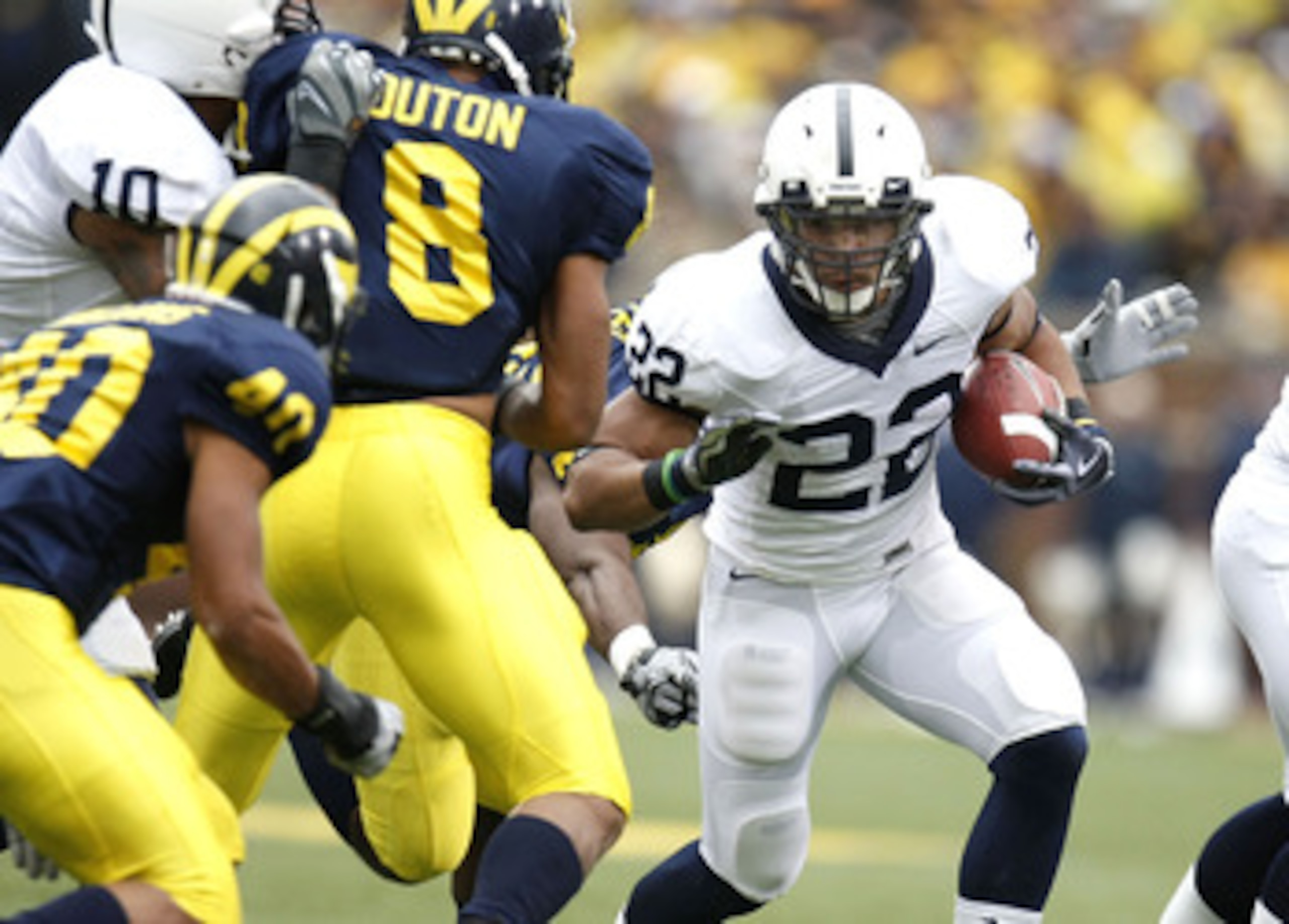 ANN ARBOR, MI - OCTOBER 24: Evan Royster #22 of the Penn State Nittany Lions looks to get around the tackle of Jonas Mouton #8 of the Michigan Wolverines on October 24, 2009 at Michigan Stadium in Ann Arbor, Michigan.  (Photo by Gregory Shamus/Getty Image