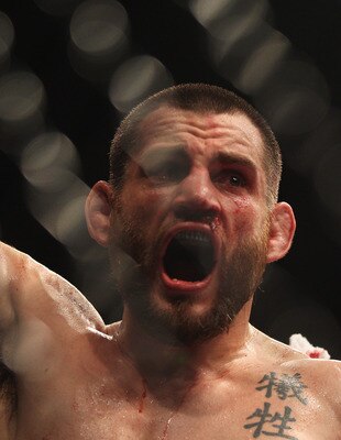 SYDNEY, AUSTRALIA - FEBRUARY 27:  Jon Fitch of the USA celebrates after his drawn fight against BJ Penn of the USA during their welterweight bout part of  UFC 127 at Acer Arena on February 27, 2011 in Sydney, Australia.  (Photo by Mark Kolbe/Getty Images)