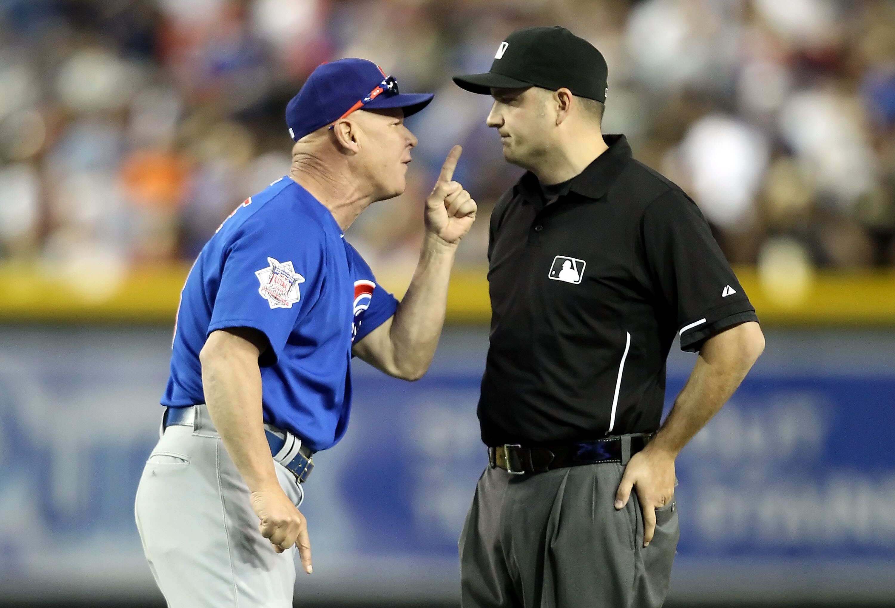PHOENIX, AZ - APRIL 30: Manager Mike Quade of the Chicago Cubs argues with second base umpire Dan Bellino after Quade was thrown out of the Major League Baseball game against the Arizona Diamondbacks at Chase Field on April 30, 2011 in Phoenix, Arizona. PHOENIX, AZ - APRIL 30: Manager Mike Quade of the Chicago Cubs argues with second base umpire Dan Bellino after Quade was thrown out of the Major League Baseball game against the Arizona Diamondbacks at Chase Field on April 30, 2011 in Phoenix, Arizona.