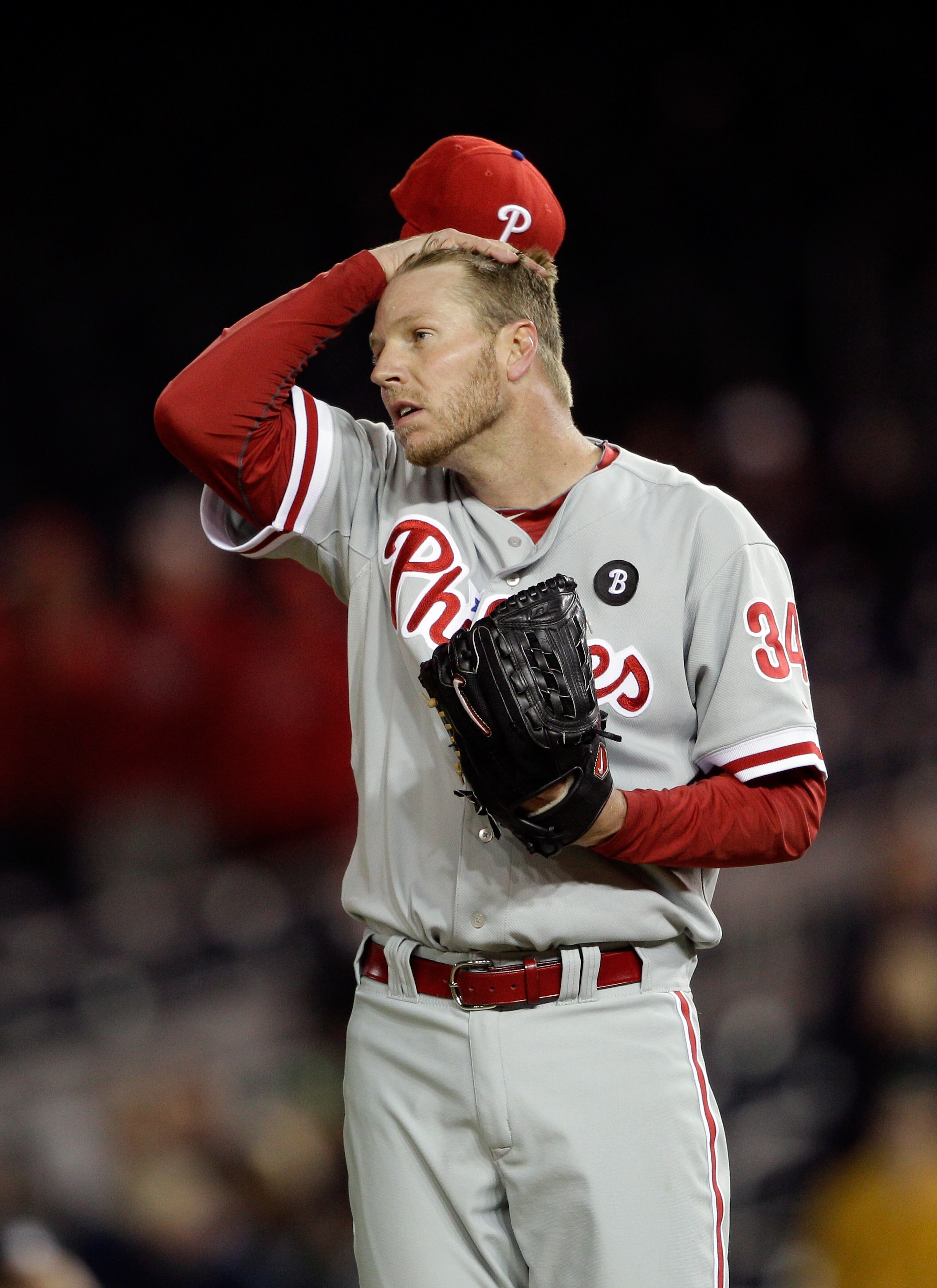 WASHINGTON, DC - APRIL 13: Roy Halladay #34 of the Philadelphia Phillies adjust his cap after giving up a run to the Washington Nationals during the ninth inning at Nationals Park on April 13, 2011 in Washington, DC. (Photo by Rob Carr/Getty Images) WASHINGTON, DC - APRIL 13: Roy Halladay #34 of the Philadelphia Phillies adjust his cap after giving up a run to the Washington Nationals during the ninth inning at Nationals Park on April 13, 2011 in Washington, DC. (Photo by Rob Carr/Getty Images)
