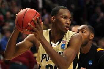 CHICAGO, IL - MARCH 20:  JaJuan Johnson #25 of the Purdue Boilermakers looks to pass against Ed Nixon #50 of the Virginia Commonwealth Rams in the second half during the third round of the 2011 NCAA men's basketball tournament at the United Center on Marc