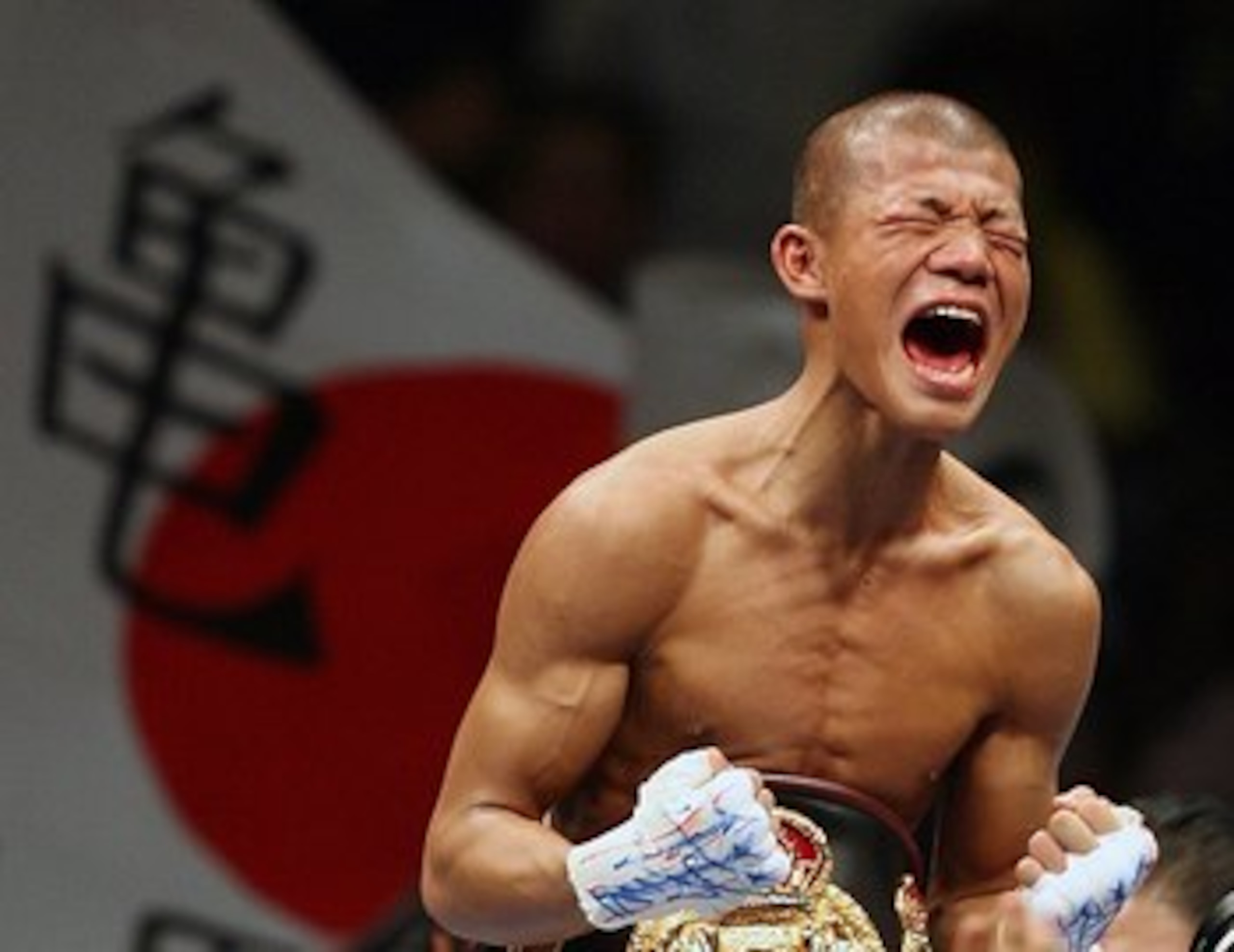 YOKOHAMA, JAPAN - AUGUST 2:  Koki Kameda of Japan celebrates after defeating Juan Jose Landaeta of Venezuela to win the World Boxing Association light flyweight title bout at Yokohama Arena August 2, 2006 in Yokohama, Japan.  (Photo by Koichi Kamoshida/Ge