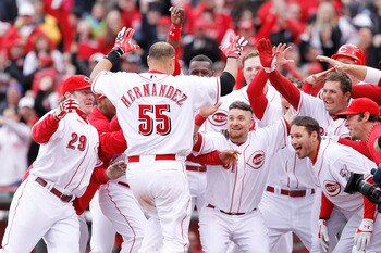 CINCINNATI, OH - MARCH 31: Ramon Hernandez #55 of the Cincinnati Reds celebrates at home plate with teammates after hitting the game-winning home run in the ninth inning against the Milwaukee Brewers in the opening day game at Great American Ballpark on M CINCINNATI, OH - MARCH 31: Ramon Hernandez #55 of the Cincinnati Reds celebrates at home plate with teammates after hitting the game-winning home run in the ninth inning against the Milwaukee Brewers in the opening day game at Great American Ballpark on M