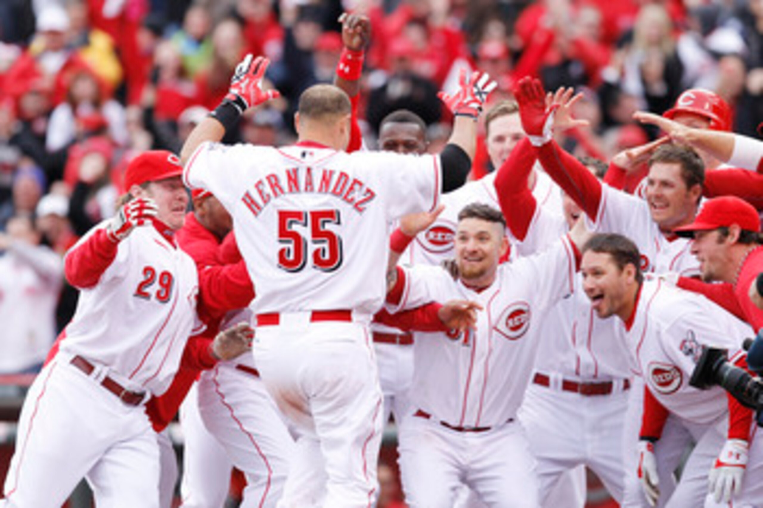 CINCINNATI, OH - MARCH 31: Ramon Hernandez #55 of the Cincinnati Reds celebrates at home plate with teammates after hitting the game-winning home run in the ninth inning against the Milwaukee Brewers in the opening day game at Great American Ballpark on M CINCINNATI, OH - MARCH 31: Ramon Hernandez #55 of the Cincinnati Reds celebrates at home plate with teammates after hitting the game-winning home run in the ninth inning against the Milwaukee Brewers in the opening day game at Great American Ballpark on M