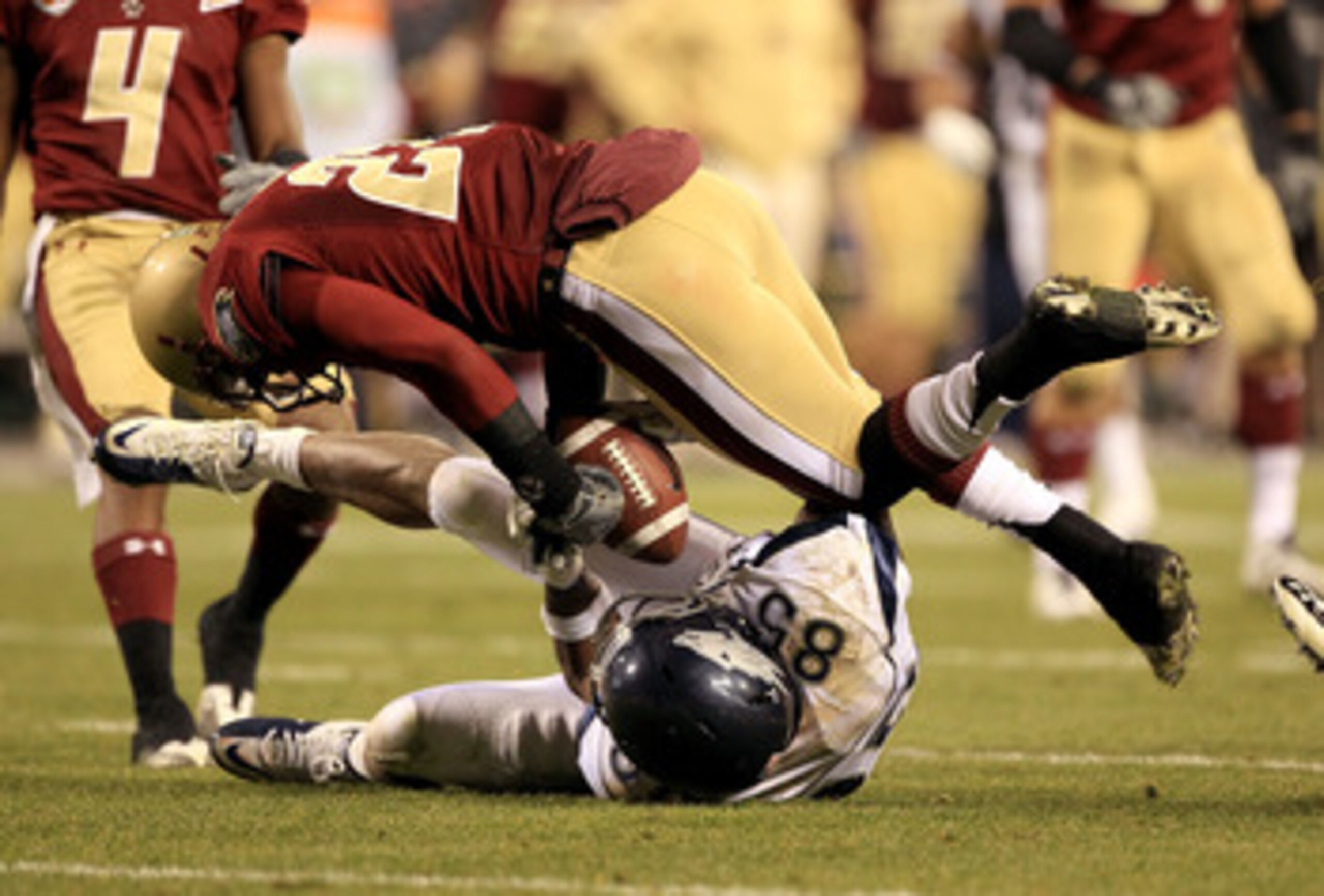 SAN FRANCISCO, CA - JANUARY 09:  Virgil Green #85 of the Nevada Wolf Pack and Okechukwu Okoroha #27 of Boston College fight for the ball during the Kraft Fight Hunger Bowl at AT&T Park on January 9, 2011 in San Francisco, California. Green came down with 