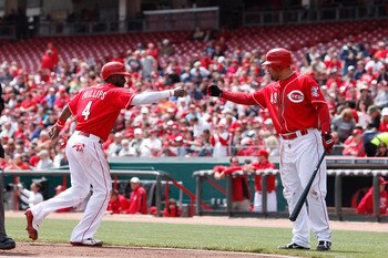 CINCINNATI, OH - APRIL 21: Brandon Phillips #4 of the Cincinnati Reds celebrates with Miguel Cairo #43 after being walked home in the first inning of the game against the Arizona Diamondbacks at Great American Ball Park on April 21, 2011 in Cincinnati, Oh CINCINNATI, OH - APRIL 21: Brandon Phillips #4 of the Cincinnati Reds celebrates with Miguel Cairo #43 after being walked home in the first inning of the game against the Arizona Diamondbacks at Great American Ball Park on April 21, 2011 in Cincinnati, Oh