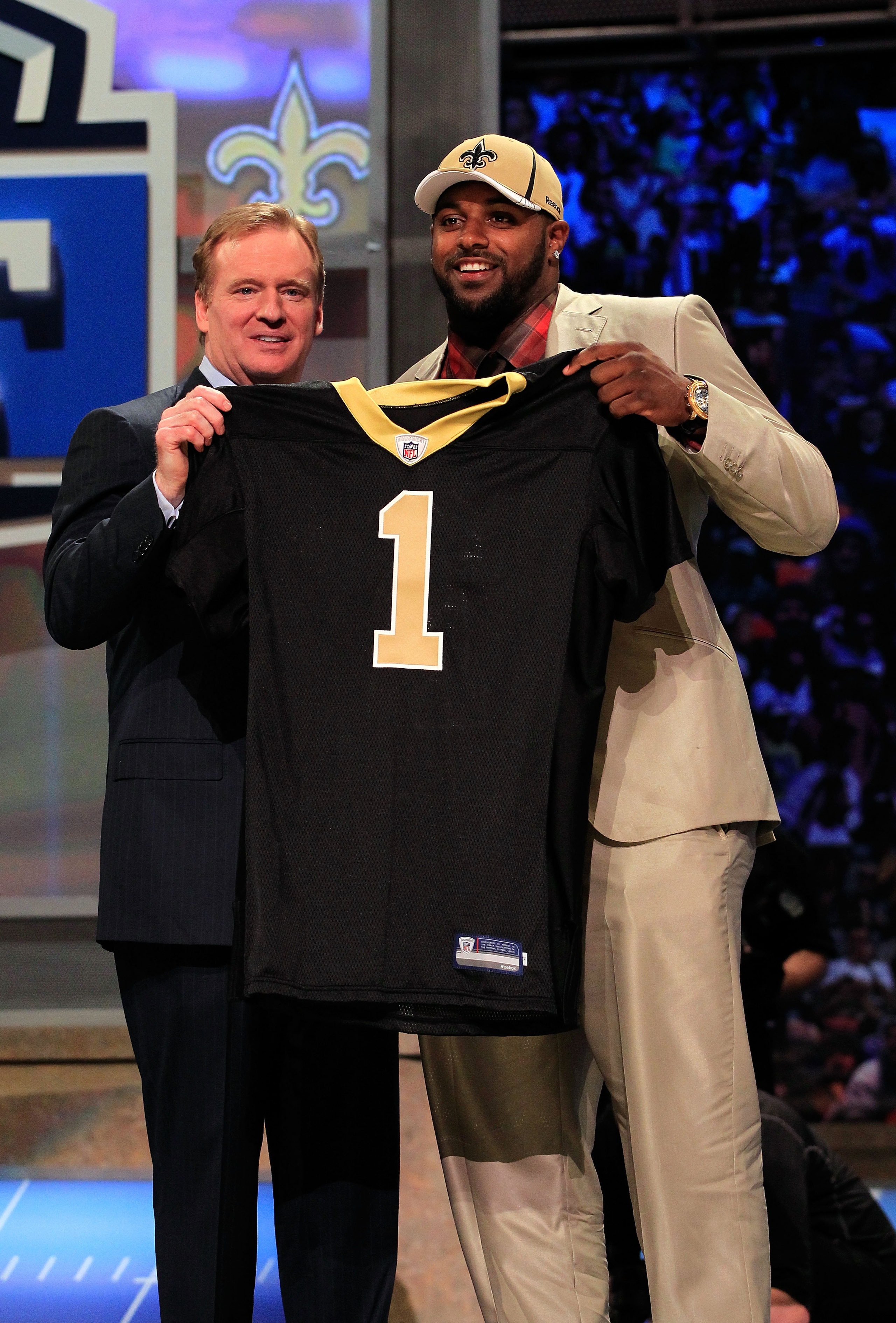 NEW YORK, NY - APRIL 28: NFL Commissioner Roger Goodell (L) poses for a photo with Cameron Jordan, #24 overall pick by the New Orleans Saints, holds up a jersey on stage during the 2011 NFL Draft at Radio City Music Hall on April 28, 2011 in New York Cit NEW YORK, NY - APRIL 28: NFL Commissioner Roger Goodell (L) poses for a photo with Cameron Jordan, #24 overall pick by the New Orleans Saints, holds up a jersey on stage during the 2011 NFL Draft at Radio City Music Hall on April 28, 2011 in New York Cit