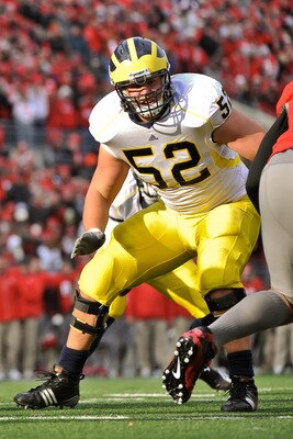 COLUMBUS, OH - NOVEMBER 27:  Stephen Schilling #52 of the Michigan Wolverines blocks against the Ohio State Buckeyes at Ohio Stadium on November 27, 2010 in Columbus, Ohio.  (Photo by Jamie Sabau/Getty Images)