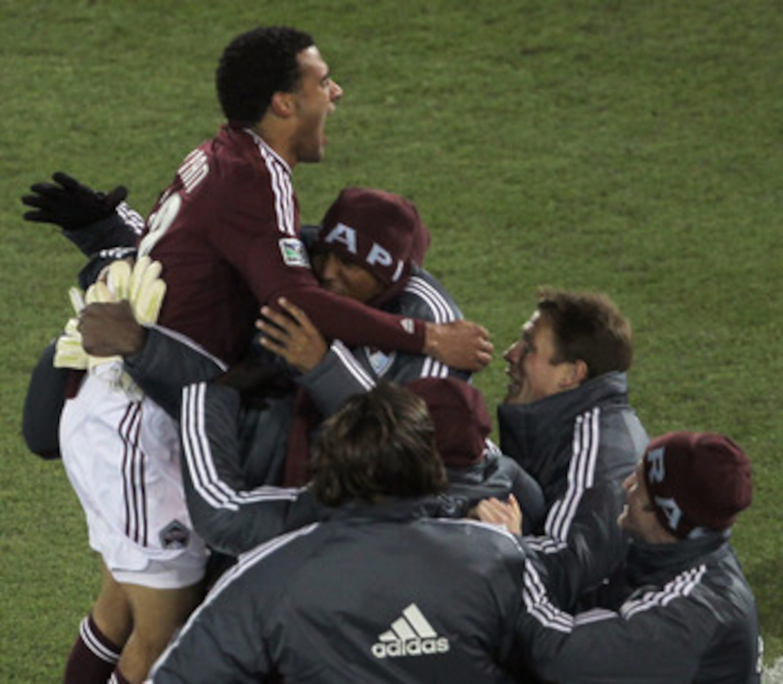 COMMERCE CITY, CO - APRIL 30:  Andre Akpan #19 of the Colorado Rapids leaps into the arms of his teammates on the bench as he celebrates his equalizing goal in the 49th minute against the Chicago Fire at Dick's Sporting Goods Park on April 30, 2011 in Com