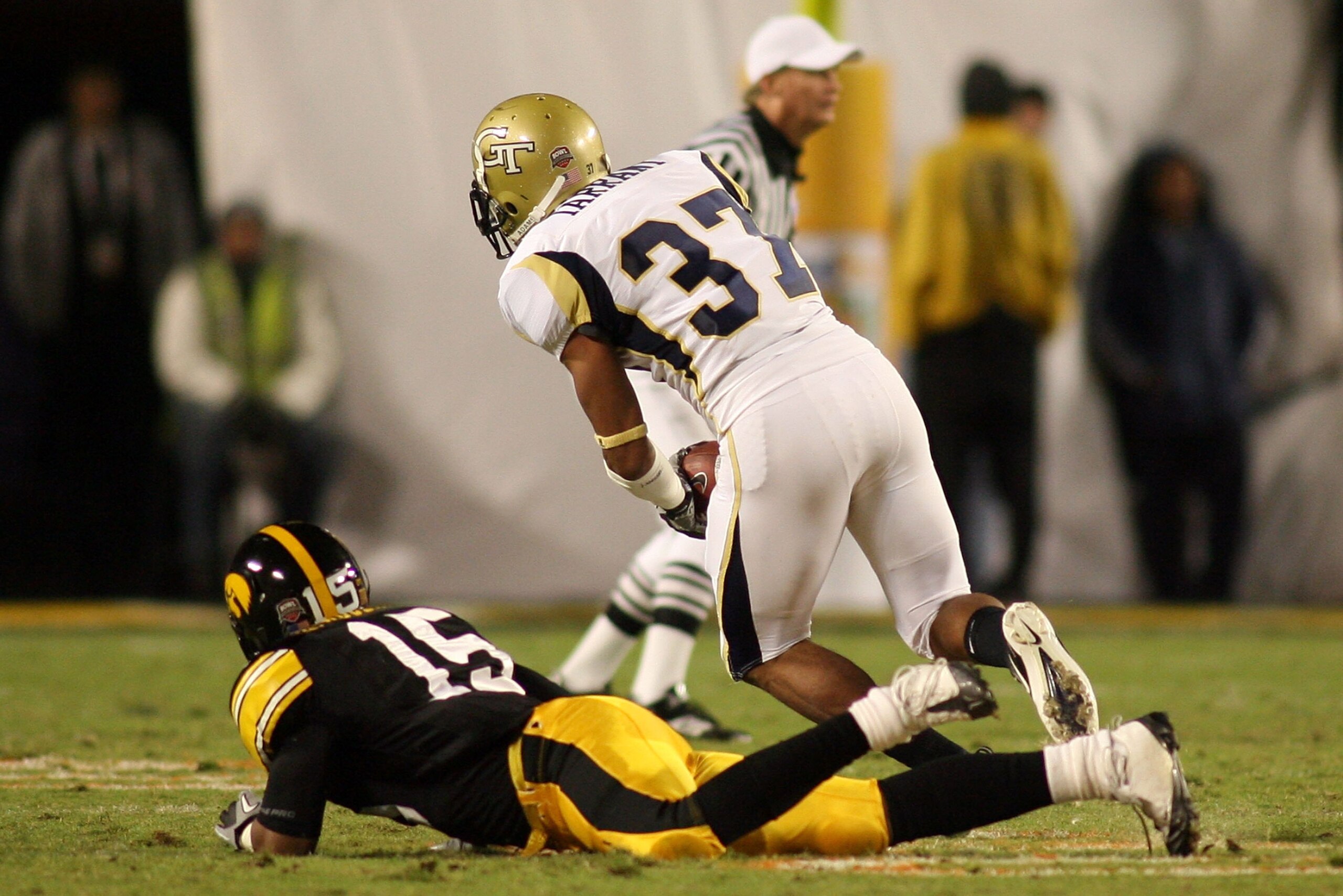 MIAMI GARDENS, FL - JANUARY 05:  Jerrard Tarrant #37 of the Georgia Tech Yellow Jackets recovers a fumble against the Iowa Hawkeyes during the FedEx Orange Bowl at Land Shark Stadium on January 5, 2010 in Miami Gardens, Florida.  (Photo by Marc Serota/Get