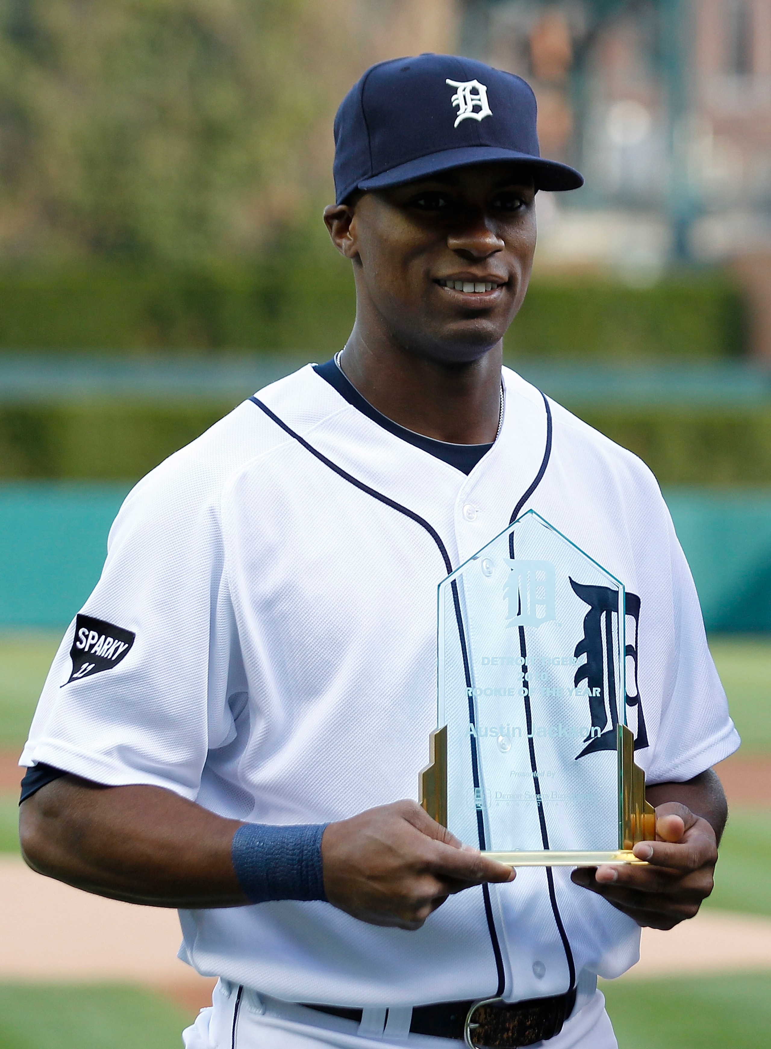 DETROIT - APRIL 26: Austin Jackson #14 of the Detroit Tigers receives the team's Rookie of The Year award prior to the start of the game against the Seattle Mariners at Comerica Park on April 26, 2011 in Detroit, Michigan. The Mariners defeated the Tigers