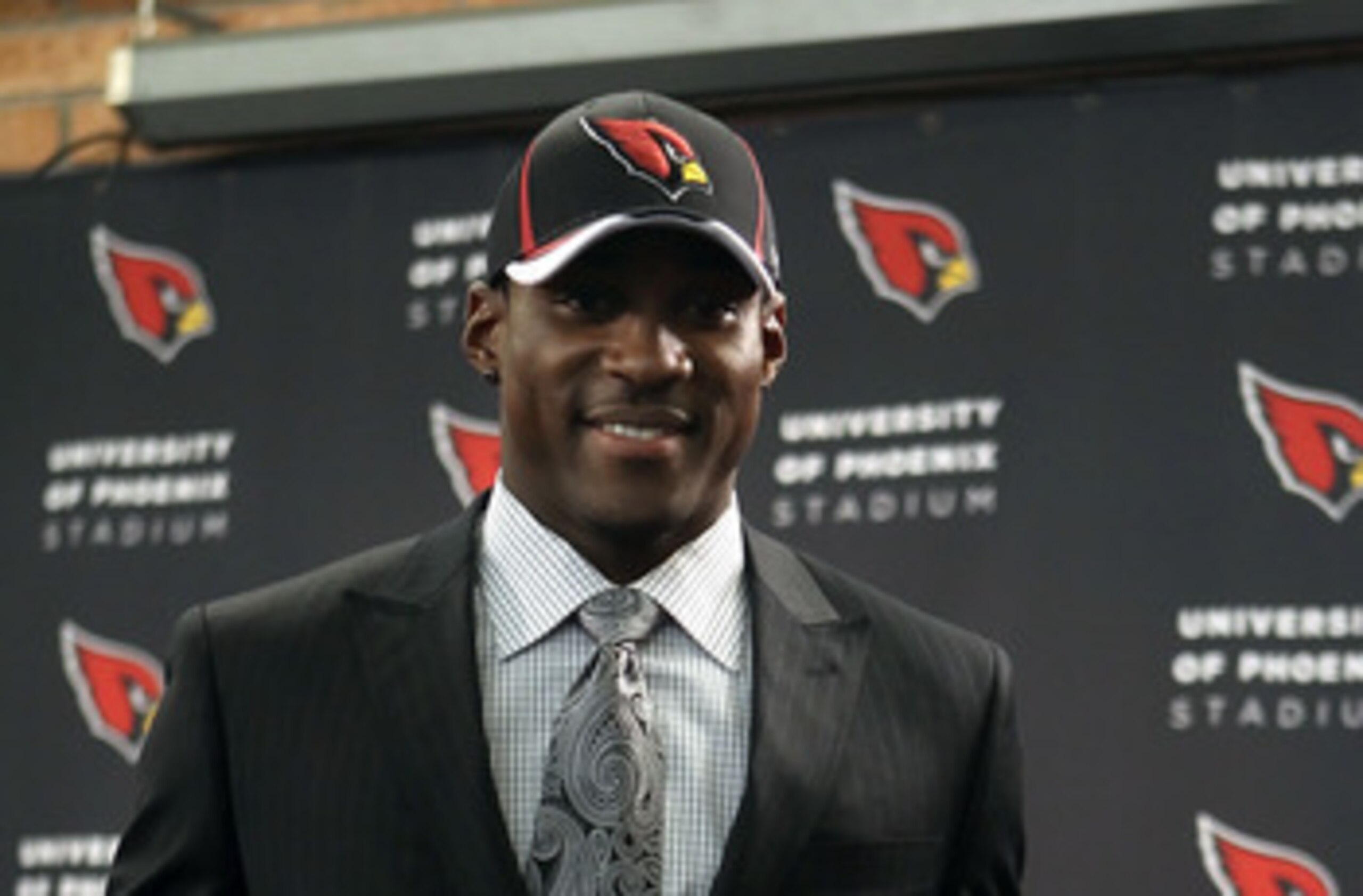 TEMPE, AZ - APRIL 29:  First round draft pick Patrick Peterson of the Arizona Cardinals poses with a team jersey during a press conference to introduce him at the team's training center auditorium on April 29, 2011 in Tempe, Arizona.  (Photo by Christian