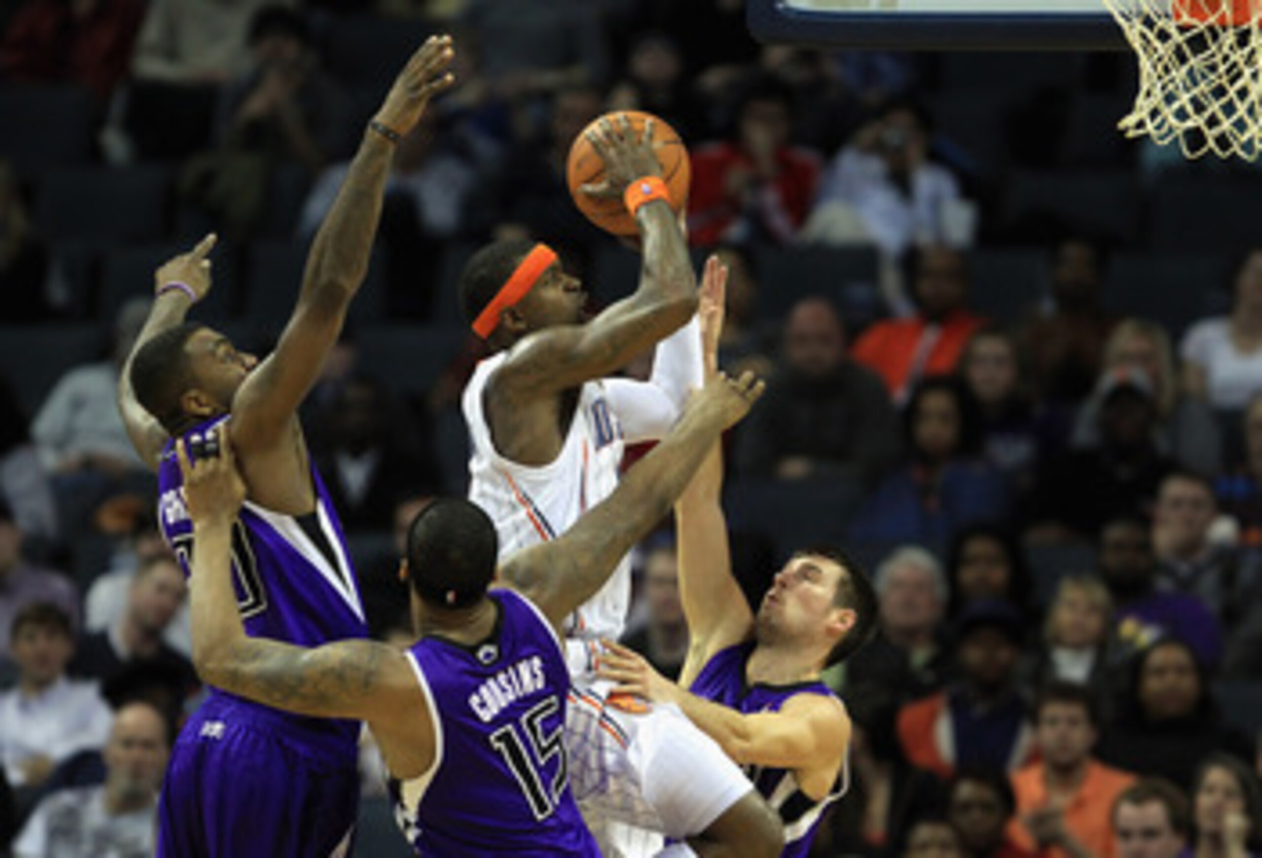 CHARLOTTE, NC - FEBRUARY 25:  Stephen Jackson #1 of the Charlotte Bobcats drives to the basket against teammates Donte Greene #20 DeMarcus Cousins #15 and Beno Udrih #19 of the Sacramento Kings during their game at Time Warner Cable Arena on February 25, 