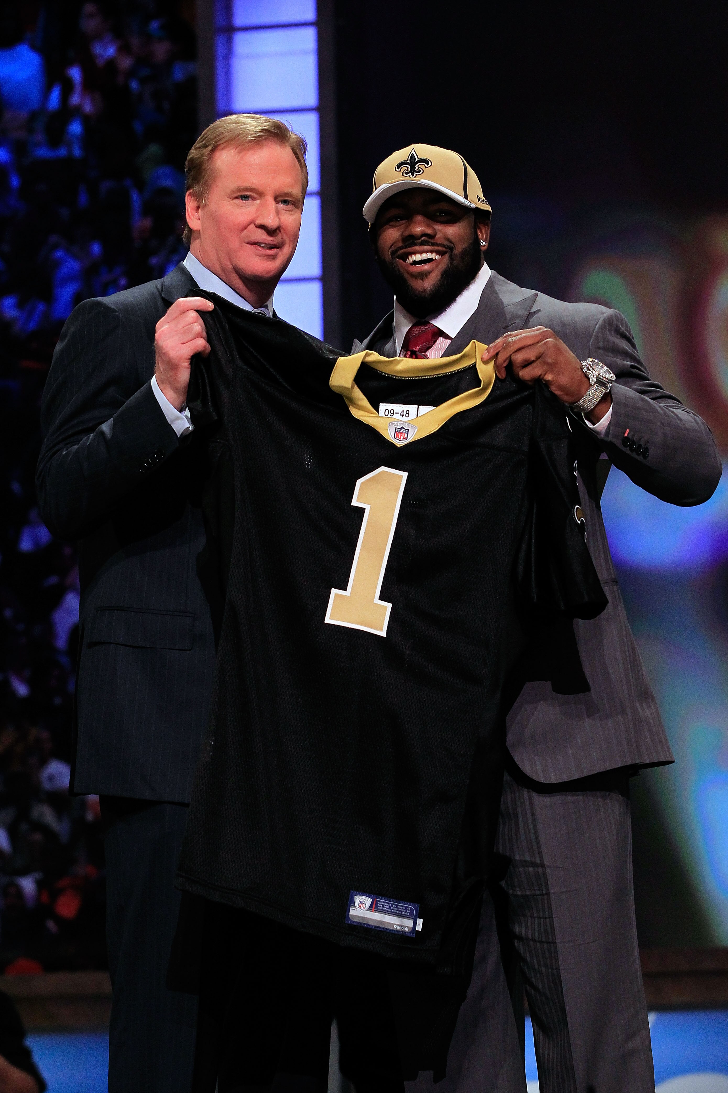 NEW YORK, NY - APRIL 28:  NFL Commissioner Roger Goodell (L) poses for a photo with Mark Ingram, #28 overall pick by the New Orleans Saints, holds up a jersey on stage during the 2011 NFL Draft at Radio City Music Hall on April 28, 2011 in New York City.