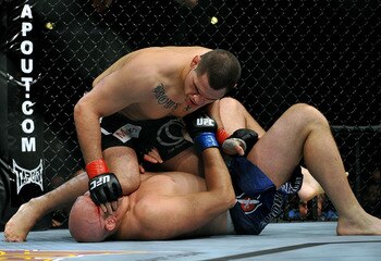 LOS ANGELES, CA - OCTOBER 24:  UFC fighter Cain Velasquez (top) battles with UFC fighter Ben Rothwell (bottom) during their Heavyweight bout at UFC 104: Machida vs. Shogun at Staples Center on October 24, 2009 in Los Angeles, California.  (Photo by Jon Ko