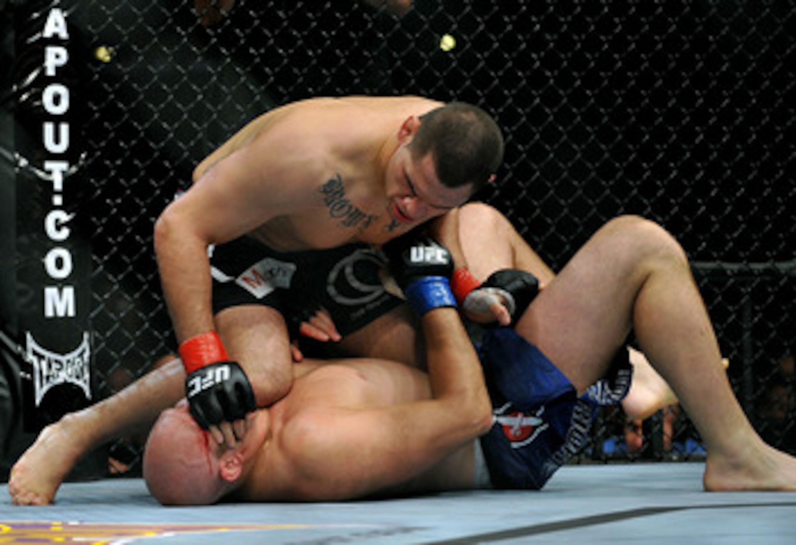 LOS ANGELES, CA - OCTOBER 24:  UFC fighter Cain Velasquez (top) battles with UFC fighter Ben Rothwell (bottom) during their Heavyweight bout at UFC 104: Machida vs. Shogun at Staples Center on October 24, 2009 in Los Angeles, California.  (Photo by Jon Ko