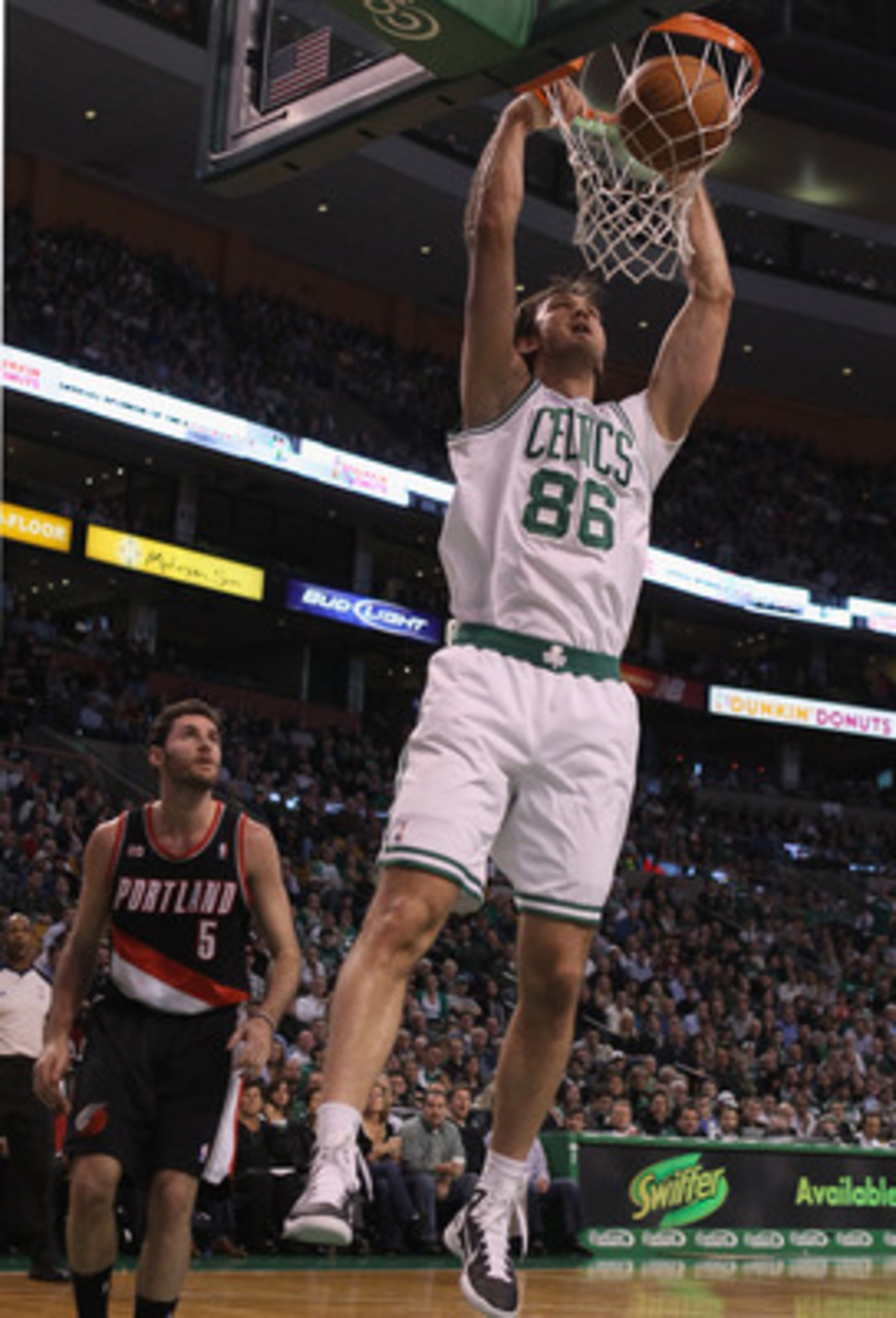 BOSTON - DECEMBER 01: Semih Erden #86 of the Boston Celtics dunks the ball as Rudy Fernandez #5 of the Portland Trailblazers defends on December 1, 2010 at the TD Garden in Boston, Massachusetts. NOTE TO USER: User expressly acknowledges and agrees that BOSTON - DECEMBER 01: Semih Erden #86 of the Boston Celtics dunks the ball as Rudy Fernandez #5 of the Portland Trailblazers defends on December 1, 2010 at the TD Garden in Boston, Massachusetts. NOTE TO USER: User expressly acknowledges and agrees that