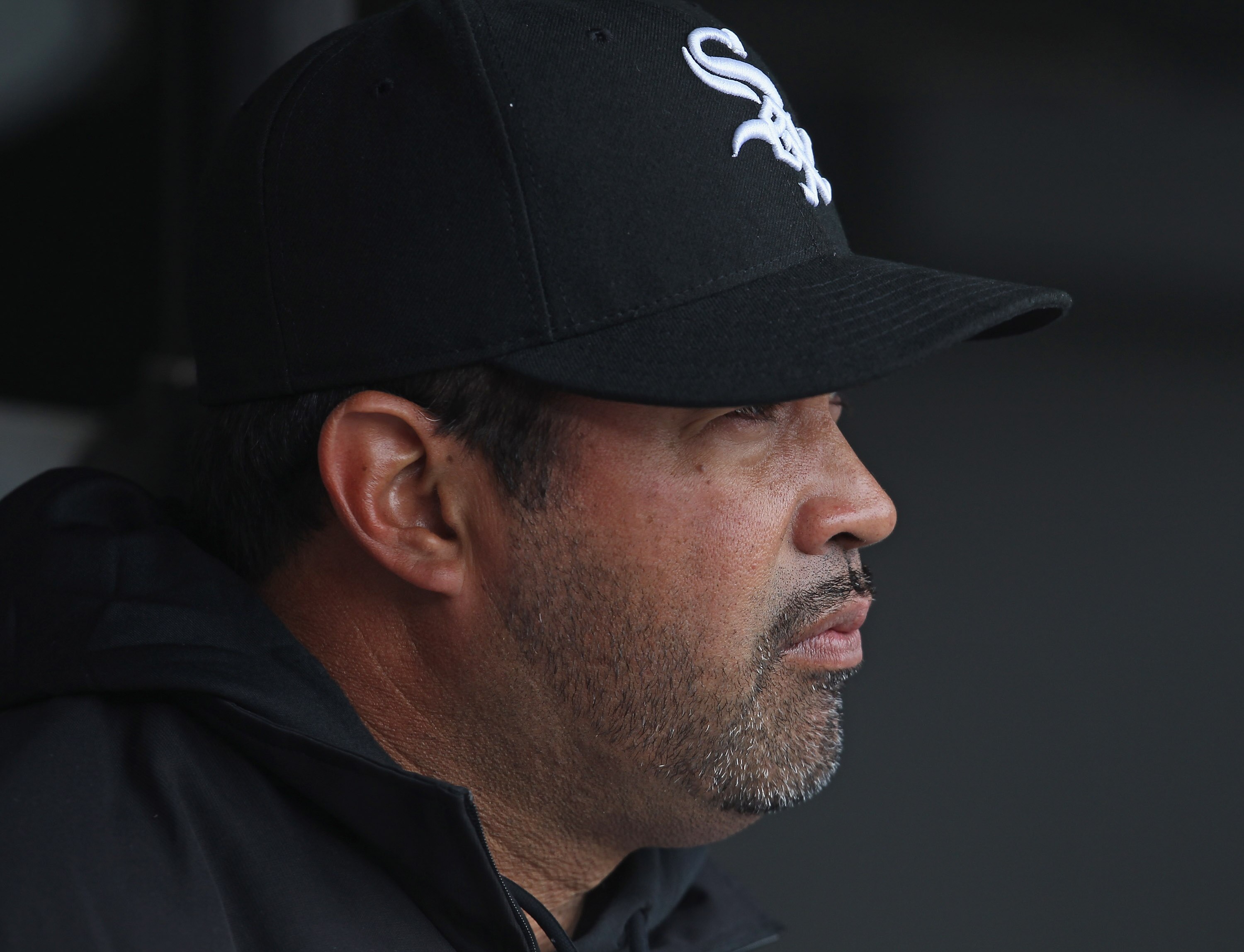CHICAGO, IL - APRIL 07: Manager Ozzie Guillen #13 of the Chicago White Sox sits in the dugout before the home opener against the Tampa Bay Rays at U.S. Cellular Field on April 7, 2011 in Chicago, Illinois. The White Sox defeated the Rays 5-1. (Photo by Jo