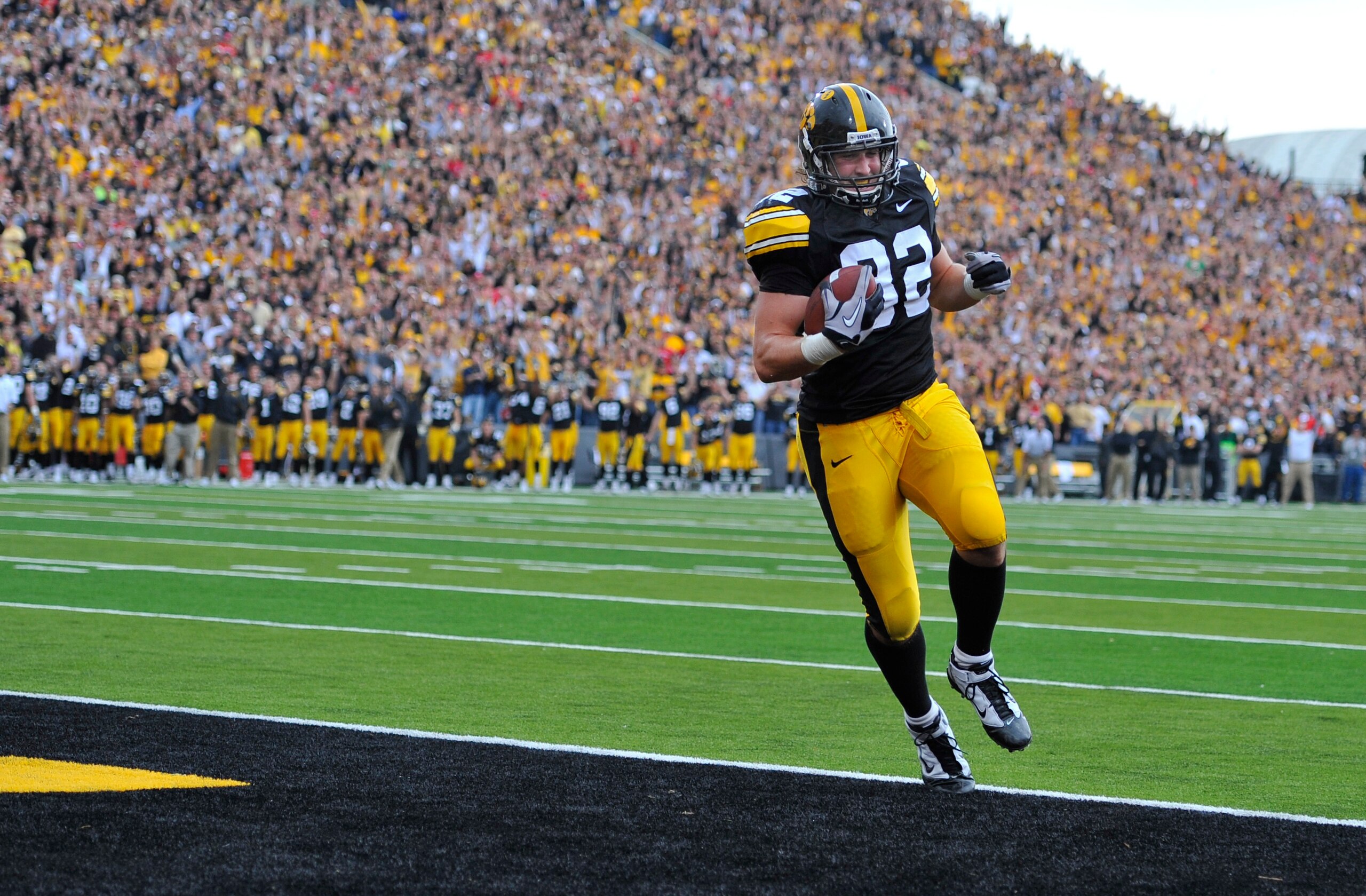 IOWA CITY, IA - OCTOBER 23- Tight end Allen Reisner #82 of the University of Iowa Hawkeyes runs into the end zone for a touchdown in the second half of play against the Wisconsin Badgers at Kinnick Stadium on October 23, 2010 in Iowa City, Iowa. Wisconsin