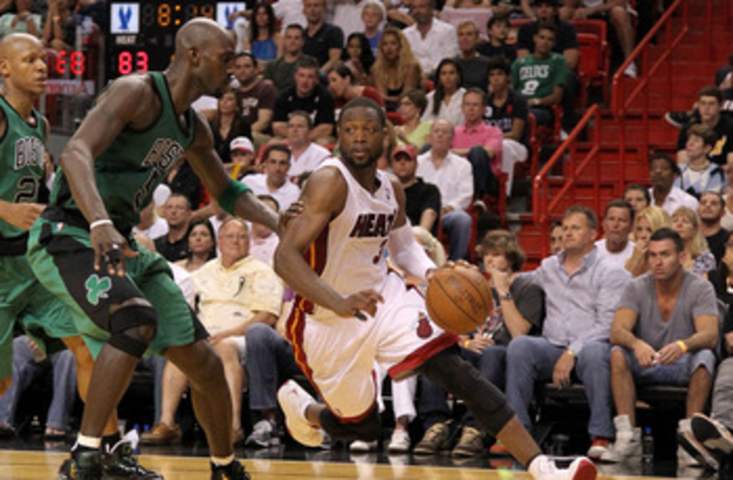 MIAMI, FL - APRIL 10:  Dwyane Wade #3 of the Miami Heat drives on Kevin Garnett #5 of the Boston Celtics during a game  at American Airlines Arena on April 10, 2011 in Miami, Florida. NOTE TO USER: User expressly acknowledges and agrees that, by downloadi