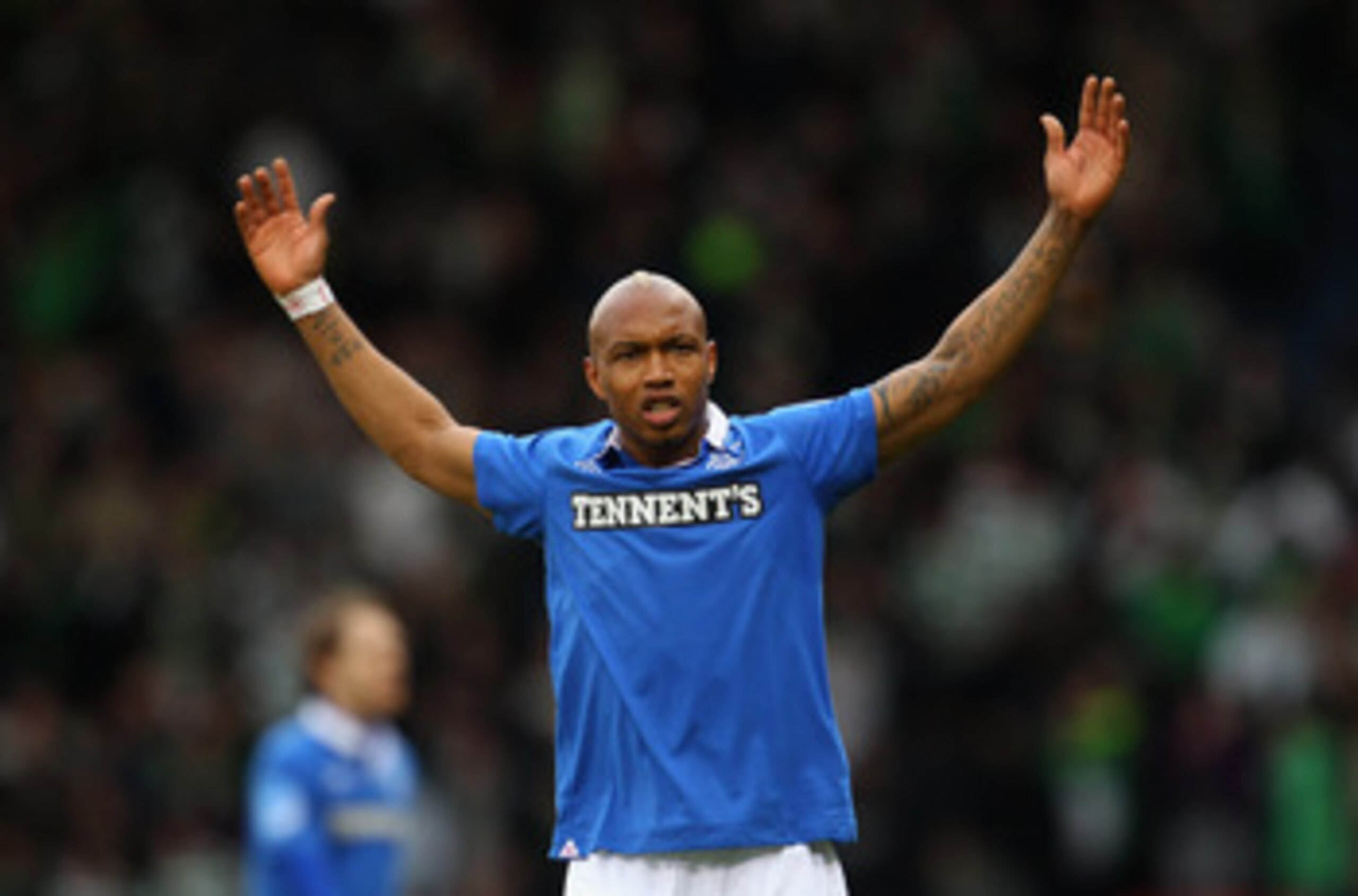 GLASGOW, SCOTLAND - MARCH 20: El Hadji Diouf of Rangers celebrates winning over Celtic during the Co-operative Insurance Cup final between at Hampden Park on March 20, 2011 in Glasgow, Scotland. (Photo by Julian Finney/Getty Images) GLASGOW, SCOTLAND - MARCH 20: El Hadji Diouf of Rangers celebrates winning over Celtic during the Co-operative Insurance Cup final between at Hampden Park on March 20, 2011 in Glasgow, Scotland. (Photo by Julian Finney/Getty Images)