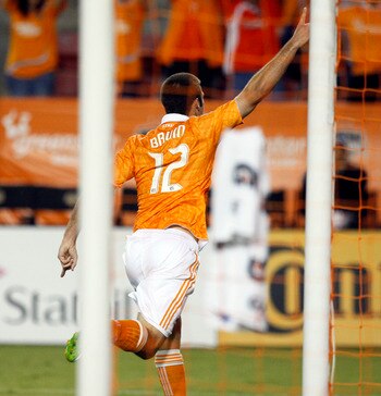 HOUSTON - APRIL 29:  Forward Will Bruin #12 of the Houston Dynamo celebrates after scoring his second goal in the first half against D.C. United at Robertson Stadium on April 29, 2011 in Houston, Texas.  (Photo by Bob Levey/Getty Images)