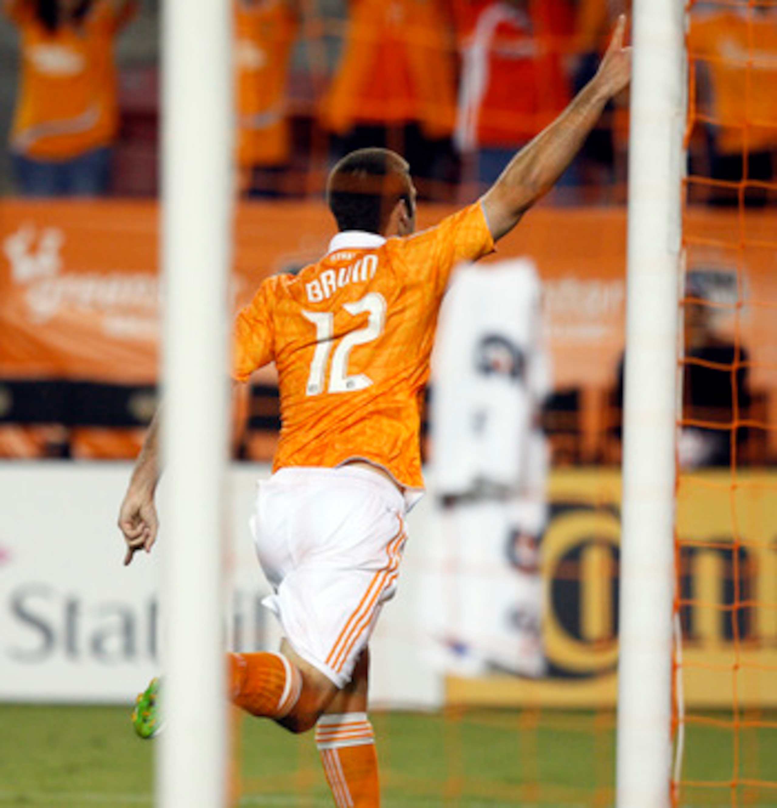 HOUSTON - APRIL 29:  Forward Will Bruin #12 of the Houston Dynamo celebrates after scoring his second goal in the first half against D.C. United at Robertson Stadium on April 29, 2011 in Houston, Texas.  (Photo by Bob Levey/Getty Images)