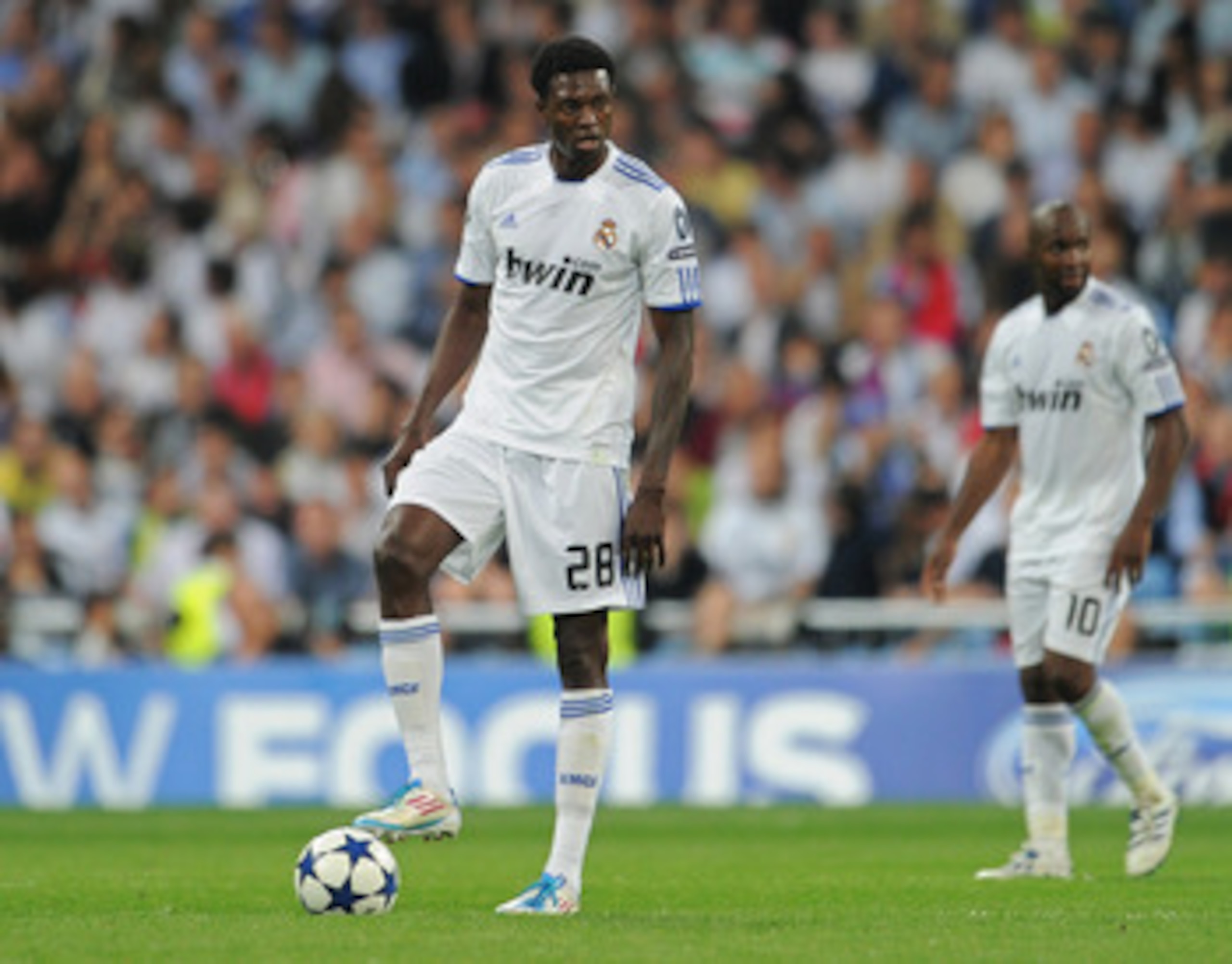MADRID, SPAIN - APRIL 27: Emmanuel Adebayor (L) of Real Madrid stands dejected backdropped by his teammate Lassana Diarra after conceding a goal during the UEFA Champions League Semi Final first leg match between Real Madrid and Barcelona at the Estadio MADRID, SPAIN - APRIL 27: Emmanuel Adebayor (L) of Real Madrid stands dejected backdropped by his teammate Lassana Diarra after conceding a goal during the UEFA Champions League Semi Final first leg match between Real Madrid and Barcelona at the Estadio