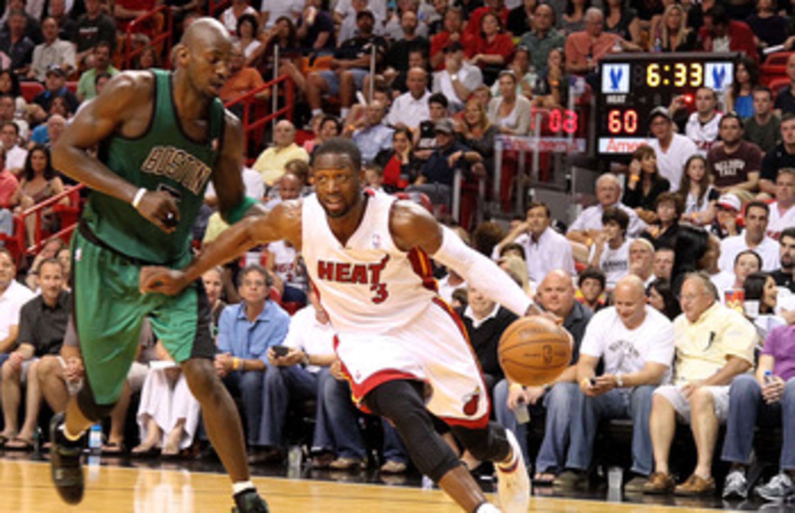 MIAMI, FL - APRIL 10:  Dwyane Wade #3 of the Miami Heat drives on Kevin Garnett #5 of the Boston Celtics during a game  at American Airlines Arena on April 10, 2011 in Miami, Florida. NOTE TO USER: User expressly acknowledges and agrees that, by downloadi