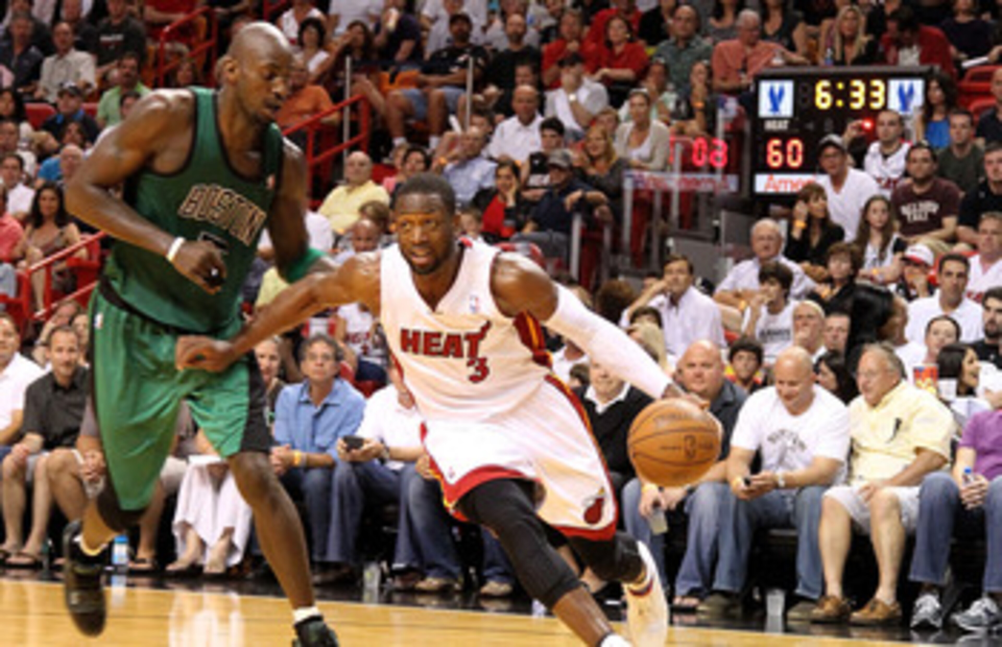 MIAMI, FL - APRIL 10:  Dwyane Wade #3 of the Miami Heat drives on Kevin Garnett #5 of the Boston Celtics during a game  at American Airlines Arena on April 10, 2011 in Miami, Florida. NOTE TO USER: User expressly acknowledges and agrees that, by downloadi