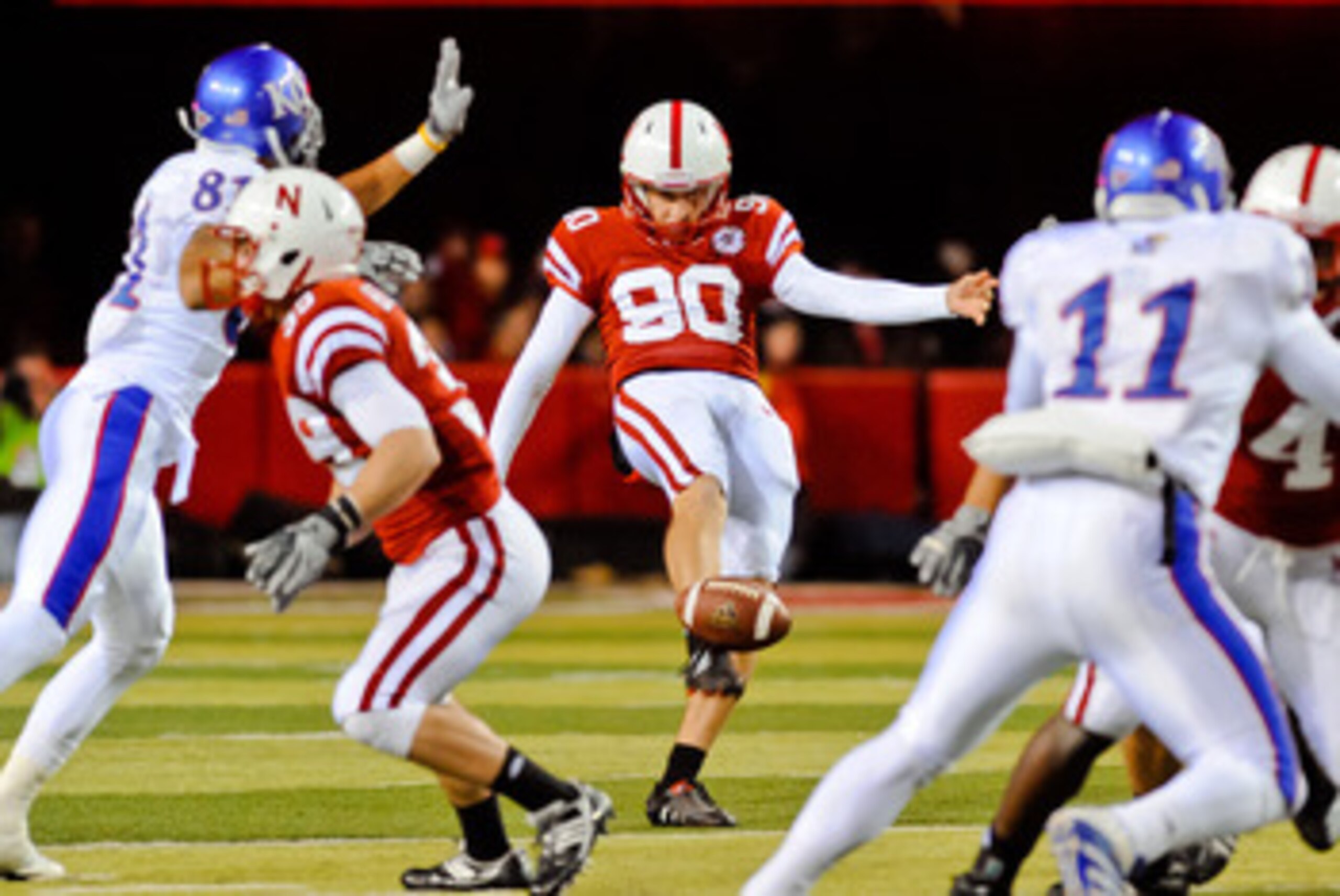 LINCOLN, NE - NOVEMBER 13: Alex Henery #90 of the Nebraska Cornhuskers punts the ball away during their game against the Kansas Jayhawks at Memorial Stadium on November 13, 2010 in Lincoln, Nebraska. Nebraska Defeated Kansas 20-3. (Photo by Eric Francis/G