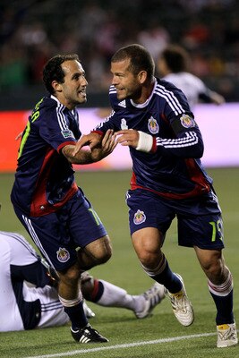 CARSON, CA - APRIL 30:  Alejandro Moreno #15 and Nick LaBrocca #10 of Chivas USA celebrate after Moreno's goal against the New England Revolution at The Home Depot Center on April 30, 2011 in Carson, California.  Chivas USA won 3-0.  (Photo by Stephen Dun