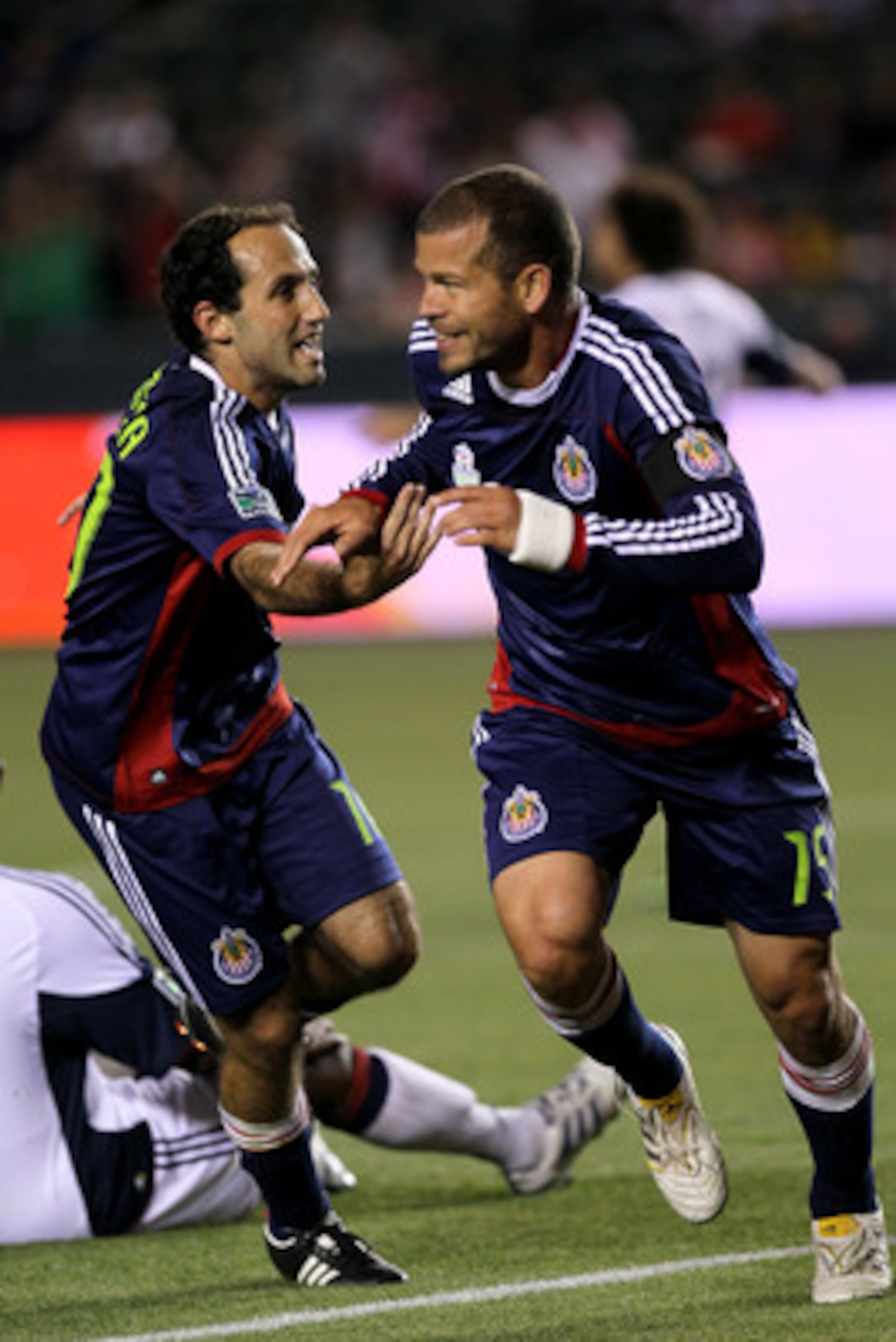 CARSON, CA - APRIL 30:  Alejandro Moreno #15 and Nick LaBrocca #10 of Chivas USA celebrate after Moreno's goal against the New England Revolution at The Home Depot Center on April 30, 2011 in Carson, California.  Chivas USA won 3-0.  (Photo by Stephen Dun