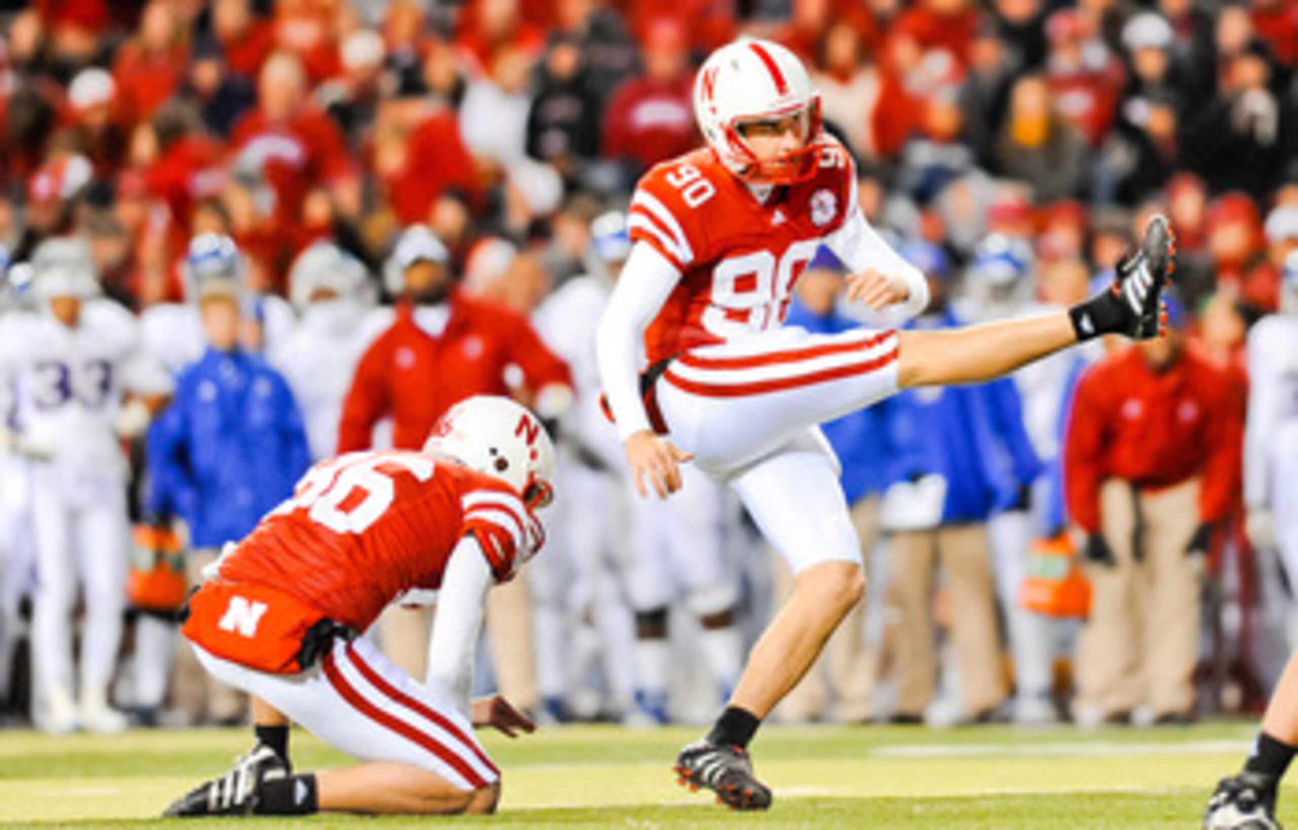 LINCOLN, NE - NOVEMBER 13: Alex Henery #90 of the Nebraska Cornhuskers kicks an extra point against the Kansas Jayhawks during their game at Memorial Stadium on November 13, 2010 in Lincoln, Nebraska. Nebraska Defeated Kansas 20-3. (Photo by Eric Francis/