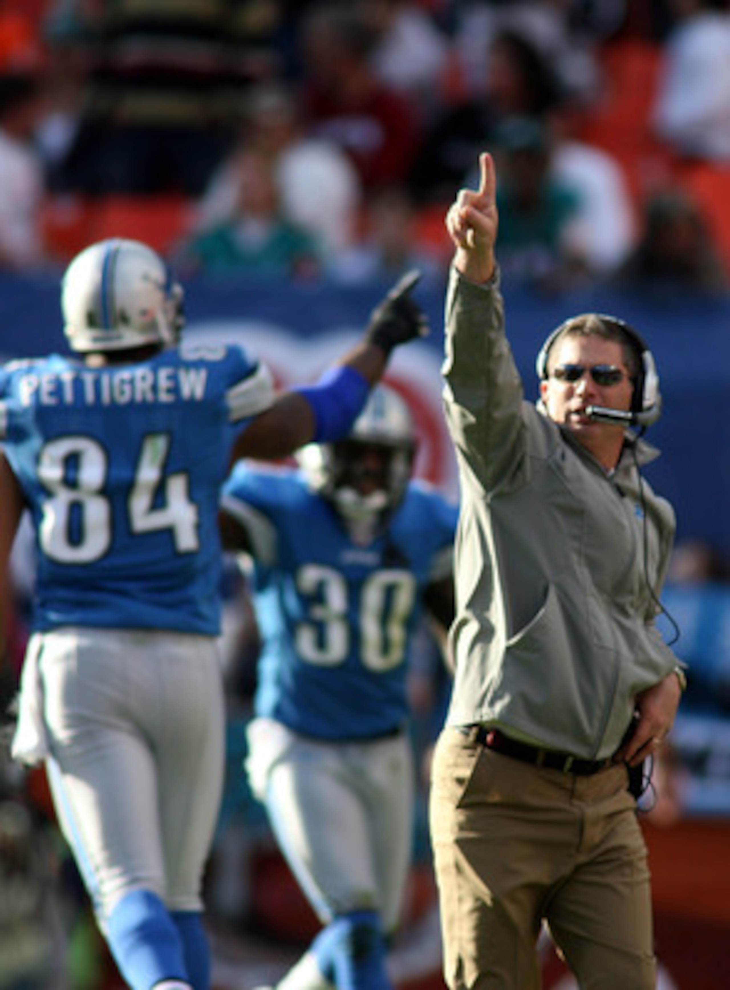 MIAMI - DECEMBER 26: Coach Jim Schwartz of the Detroit Lions celebrates a touchdown against the Miami Dolphins at Sun Life Stadium on December 26, 2010 in Miami, Florida. The Lions defeated the Dolphins 34-27.  (Photo by Marc Serota/Getty Images)