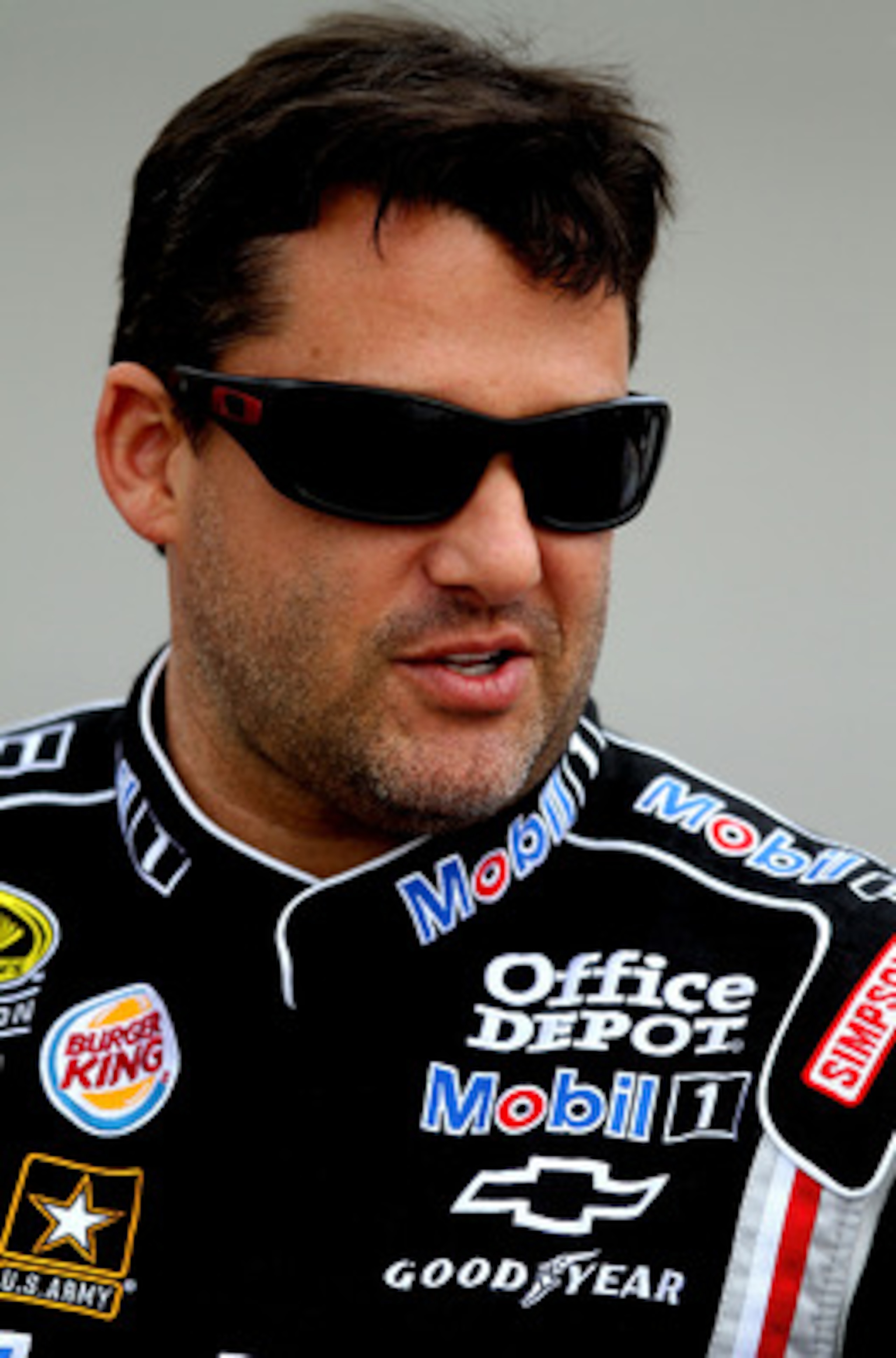 RICHMOND, VA - APRIL 29:  Tony Stewart, driver of the #14 Mobil 1/Office Depot Chevrolet, stands on pit road during qualifying for the NASCAR Sprint Cup Series Crown Royal Presents The Matthew & Daniel Hansen 400 at Richmond International Raceway on April