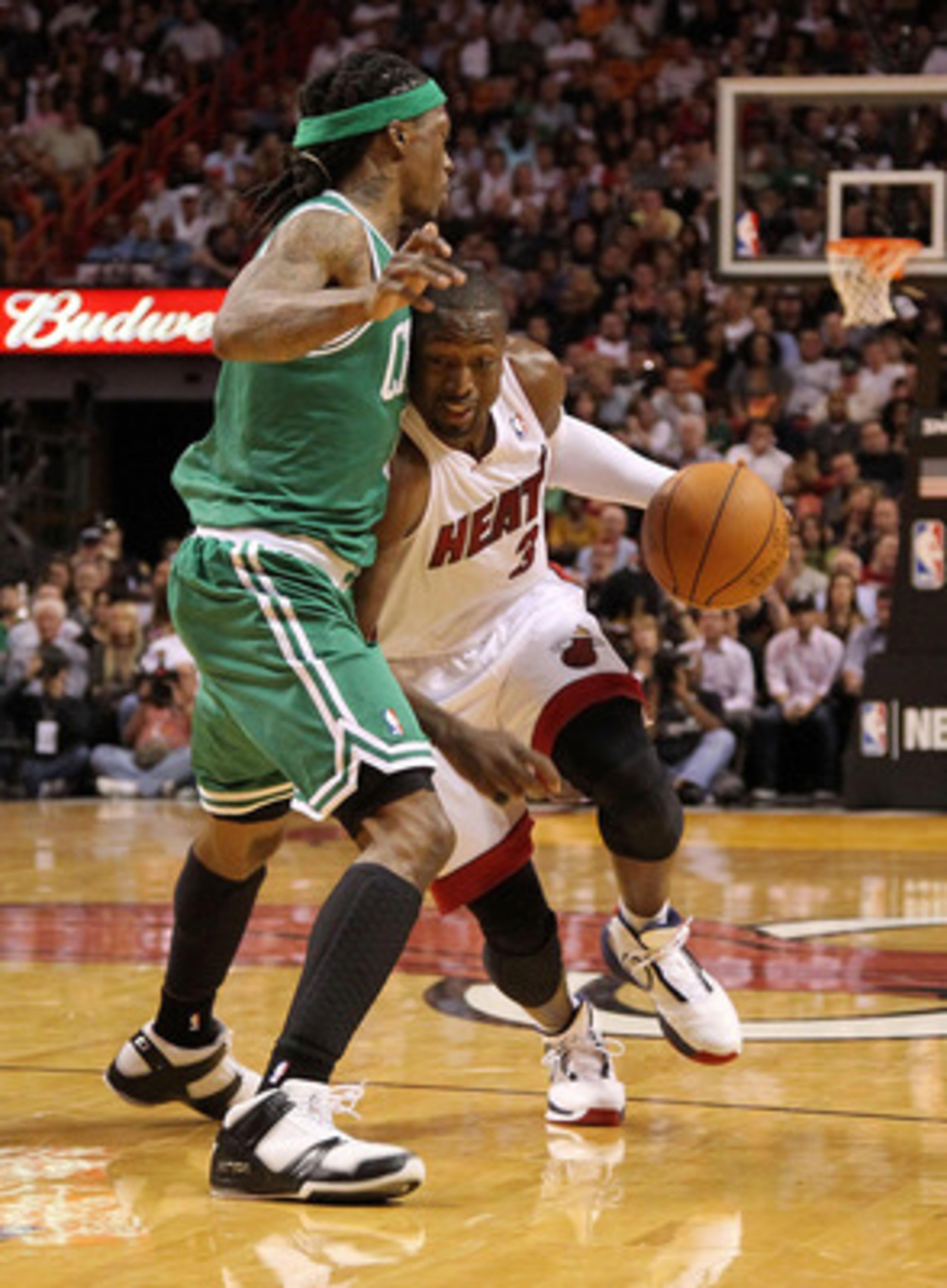 MIAMI - NOVEMBER 11:  Dwyane Wade #3 of the Miami Heat drives against Marquis Daniels #8 during a game against the Boston Celtics at American Airlines Arena on November 11, 2010 in Miami, Florida. NOTE TO USER: User expressly acknowledges and agrees that,