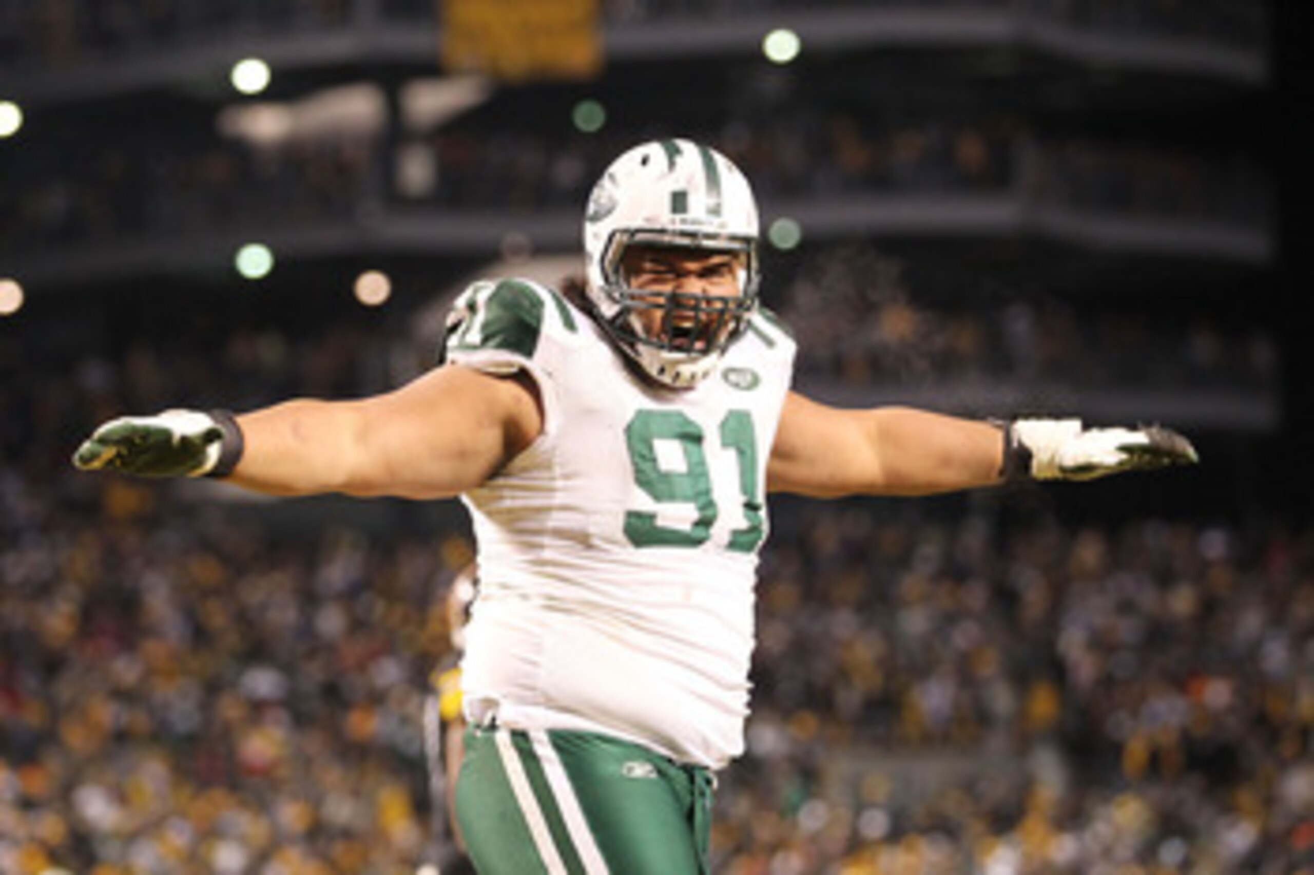 PITTSBURGH, PA - JANUARY 23:  Sione Pouha #91 of the New York Jets reacts during their 19 to 24 loss to the Pittsburgh Steelers in the 2011 AFC Championship game at Heinz Field on January 23, 2011 in Pittsburgh, Pennsylvania.  (Photo by Ronald Martinez/Ge