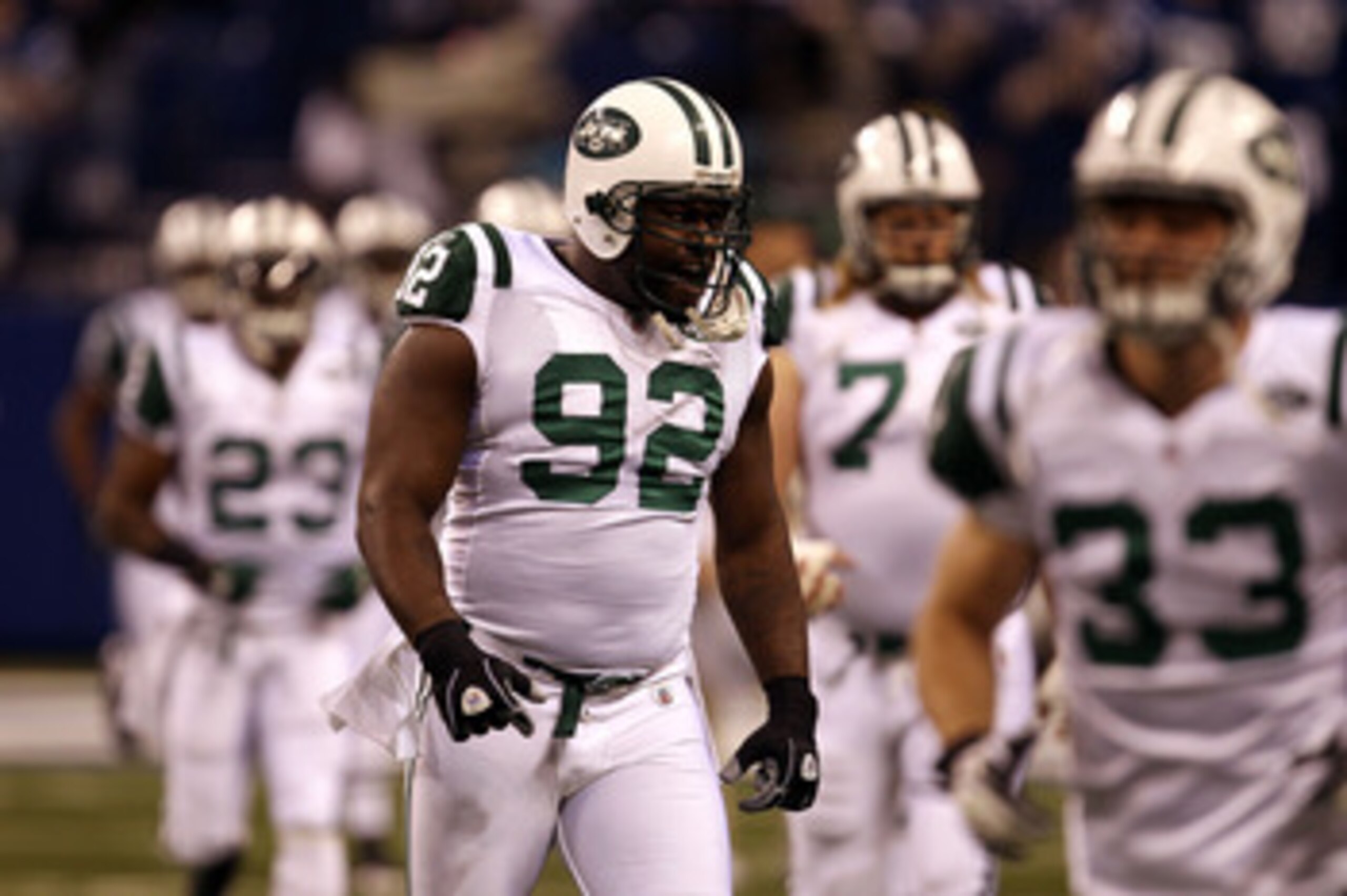 INDIANAPOLIS, IN - JANUARY 08:  Shaun Ellis #92 of the New York Jets takes the field with his teammates to play against the Indianapolis Colts during their 2011 AFC wild card playoff game at Lucas Oil Stadium on January 8, 2011 in Indianapolis, Indiana. T