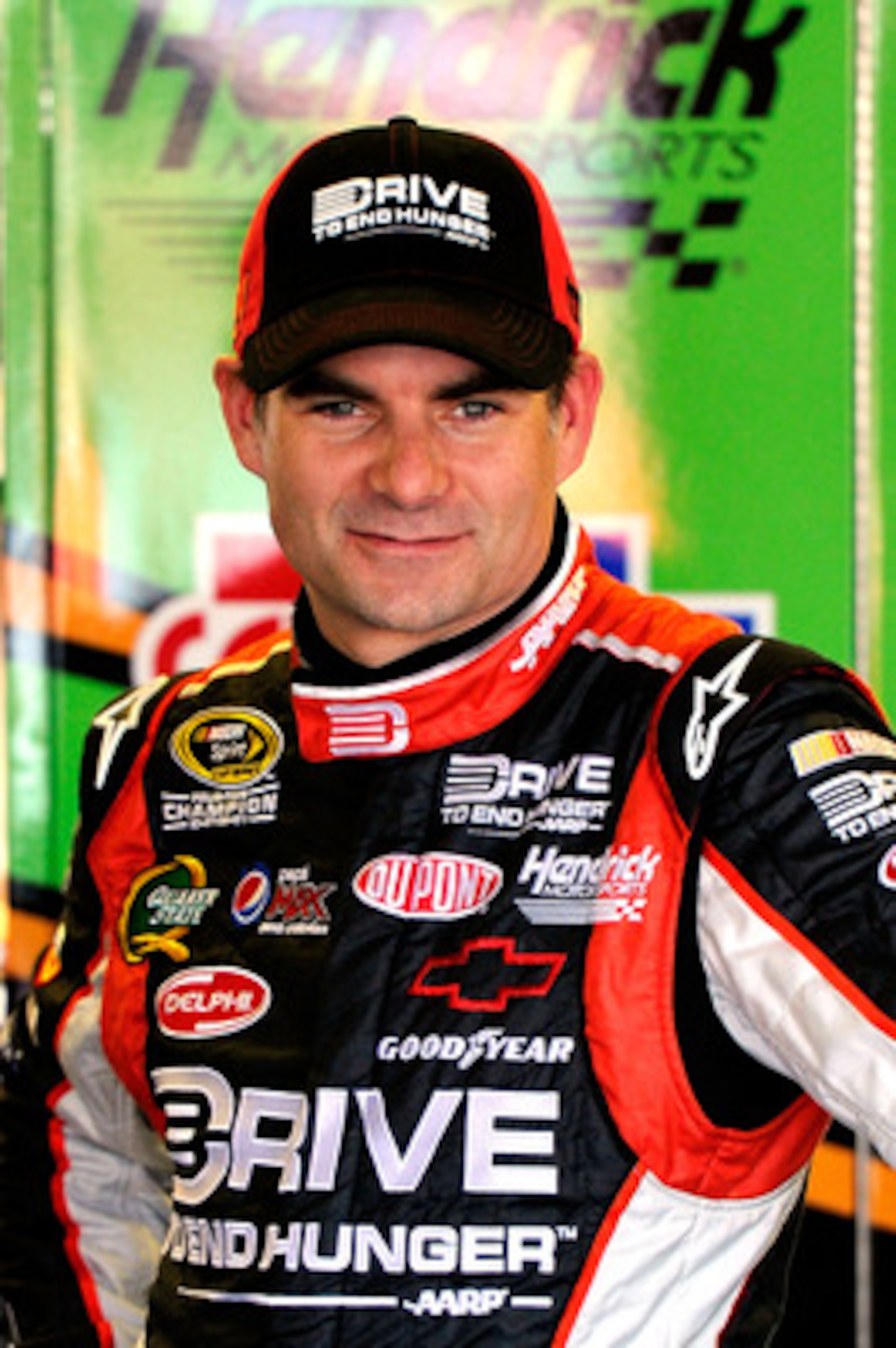 TALLADEGA, AL - APRIL 15:  Jeff Gordon, driver of the #24 Drive to End Hunger/AARP Chevrolet, stands in the garage during practice for the NASCAR Sprint Cup Series Aaron's 499 at Talladega Superspeedway on April 15, 2011 in Talladega, Alabama.  (Photo by