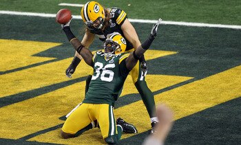ARLINGTON, TX - FEBRUARY 06:  Nick Collins #36 of the Green Bay Packers celebrates with teammate Clay Matthews #52 after Collins returned an interception for a touchdown against the Pittsburgh Steelers during Super Bowl XLV at Cowboys Stadium on February