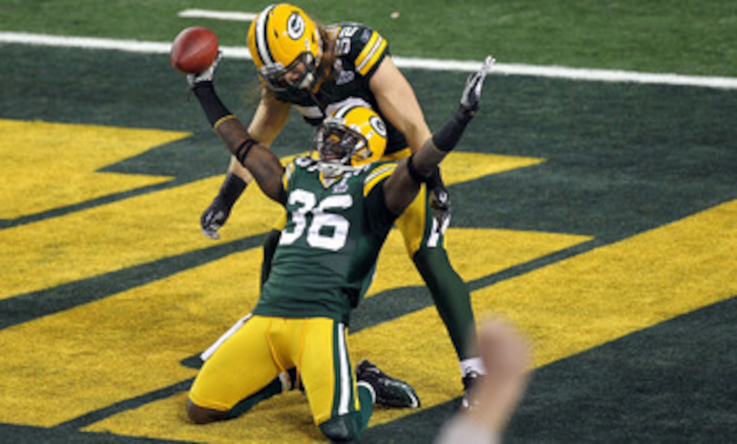ARLINGTON, TX - FEBRUARY 06: Nick Collins #36 of the Green Bay Packers celebrates with teammate Clay Matthews #52 after Collins returned an interception for a touchdown against the Pittsburgh Steelers during Super Bowl XLV at Cowboys Stadium on February ARLINGTON, TX - FEBRUARY 06: Nick Collins #36 of the Green Bay Packers celebrates with teammate Clay Matthews #52 after Collins returned an interception for a touchdown against the Pittsburgh Steelers during Super Bowl XLV at Cowboys Stadium on February