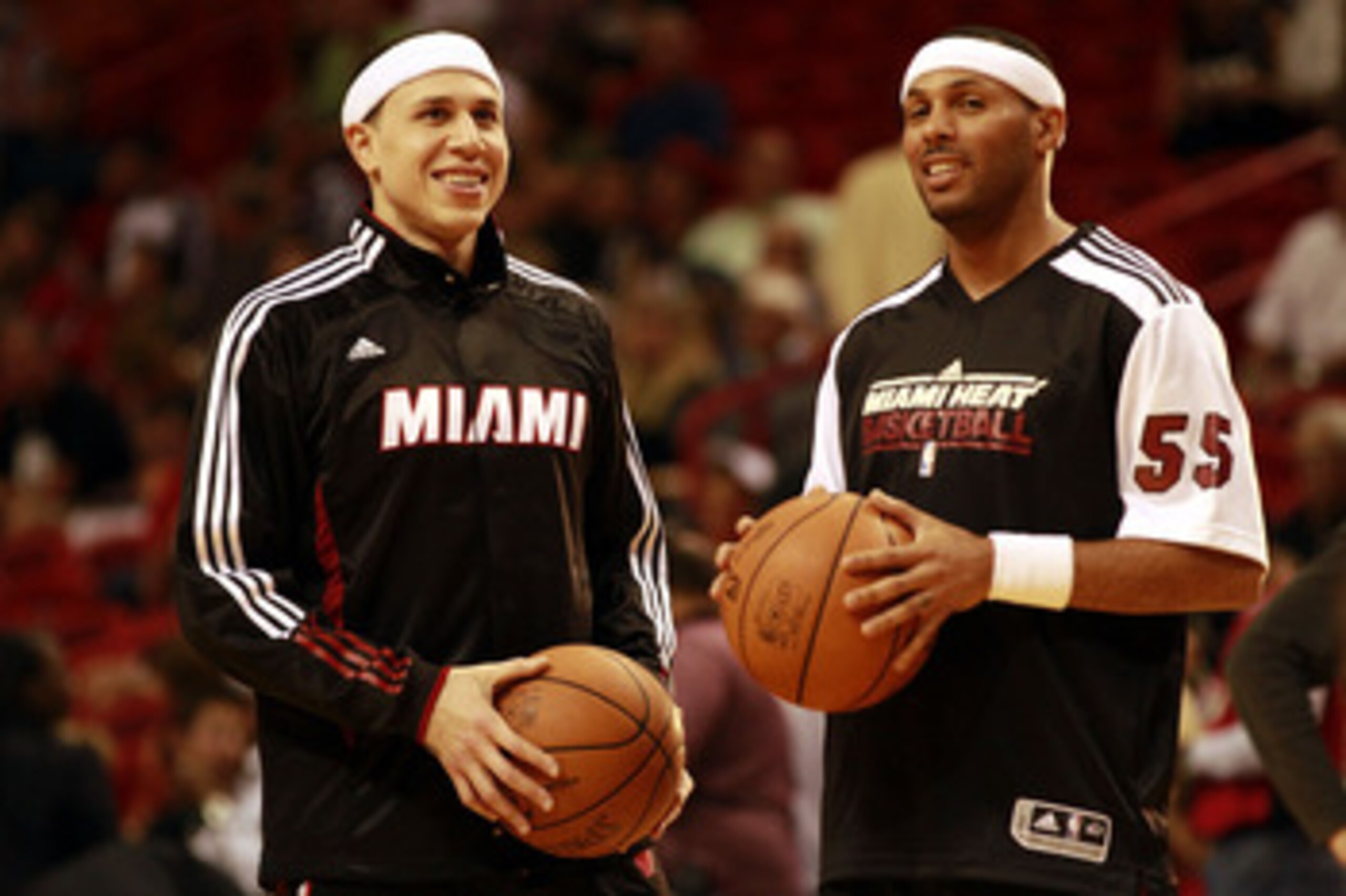 MIAMI - MARCH 12:  Guard Mike Bibby #0 of the Miami Heat (L) chats with teamate Eddie House #55  against the Memphis Grizzlie at American Airlines Arena on March 12, 2011 in Miami, Florida. NOTE TO USER: User expressly acknowledges and agrees that, by dow